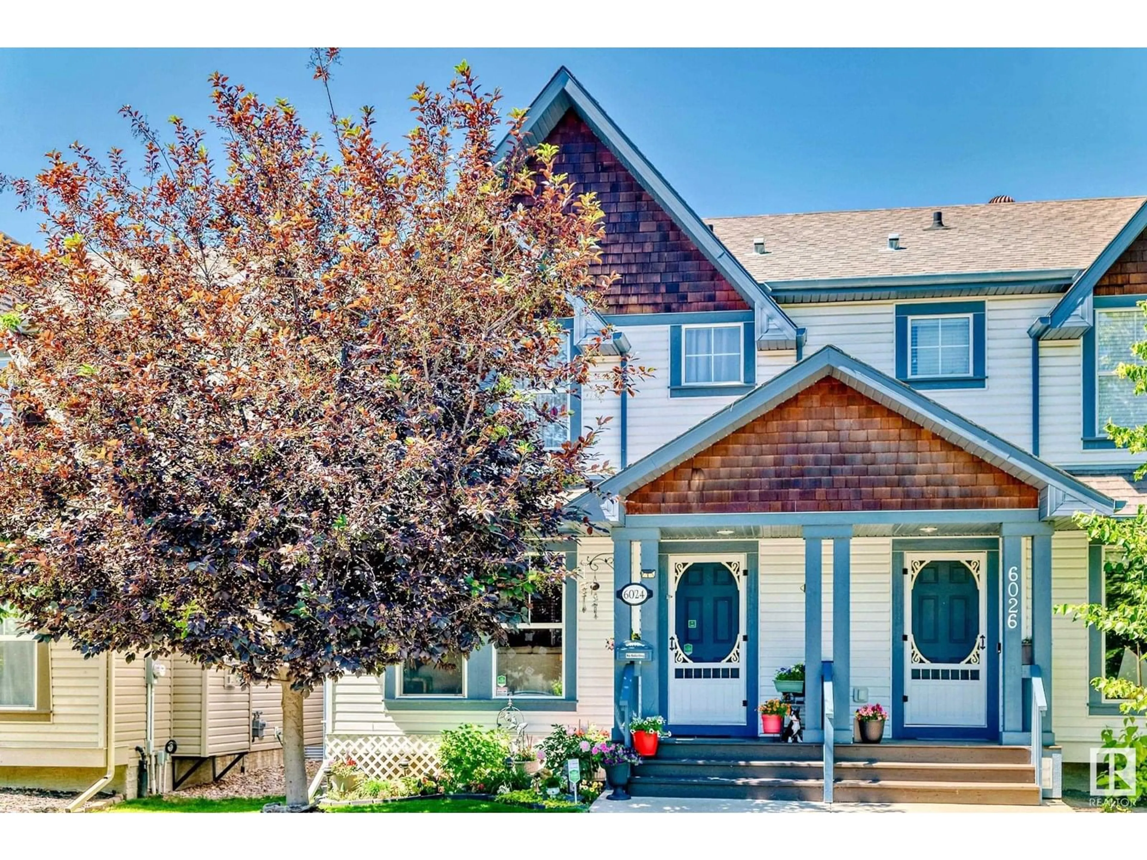 Home with vinyl exterior material, street for NW - 6024 213 ST, Edmonton Alberta T6M0J9