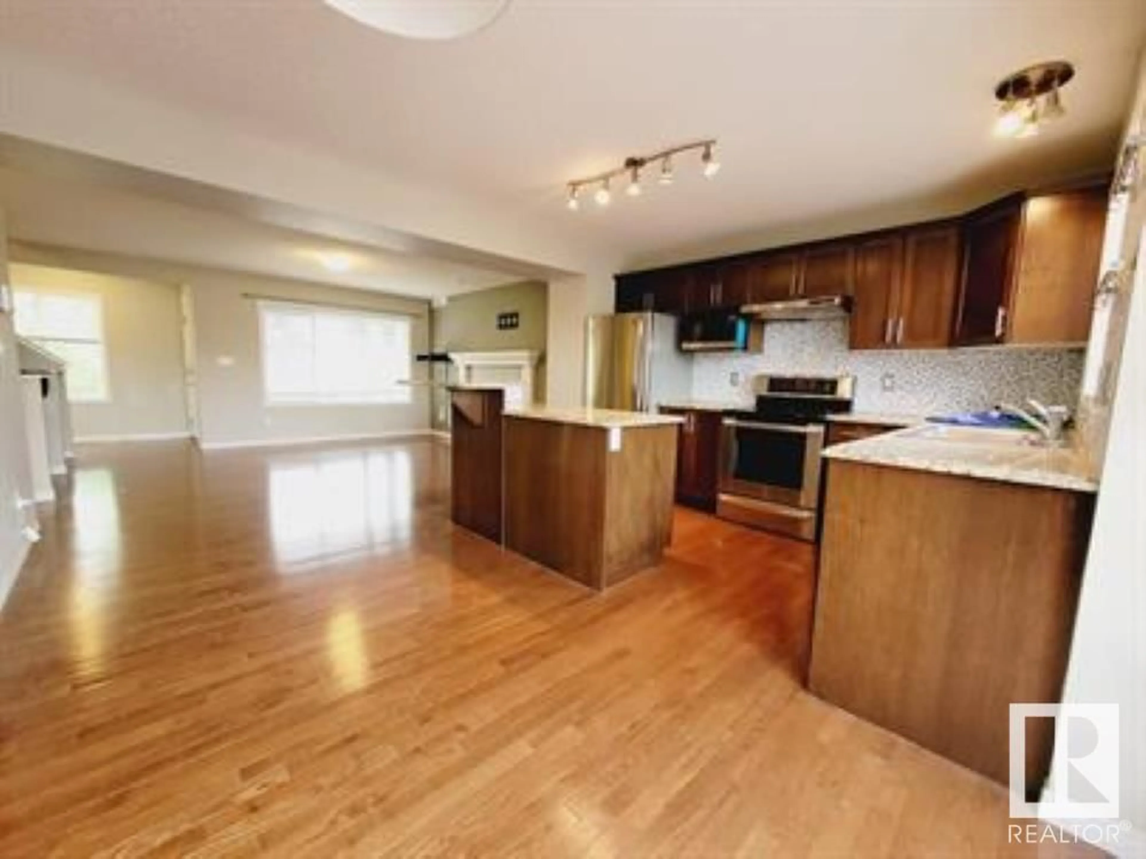 Open concept kitchen, wood/laminate floor for 7707 SCHMID CR, Edmonton Alberta T6R0K6