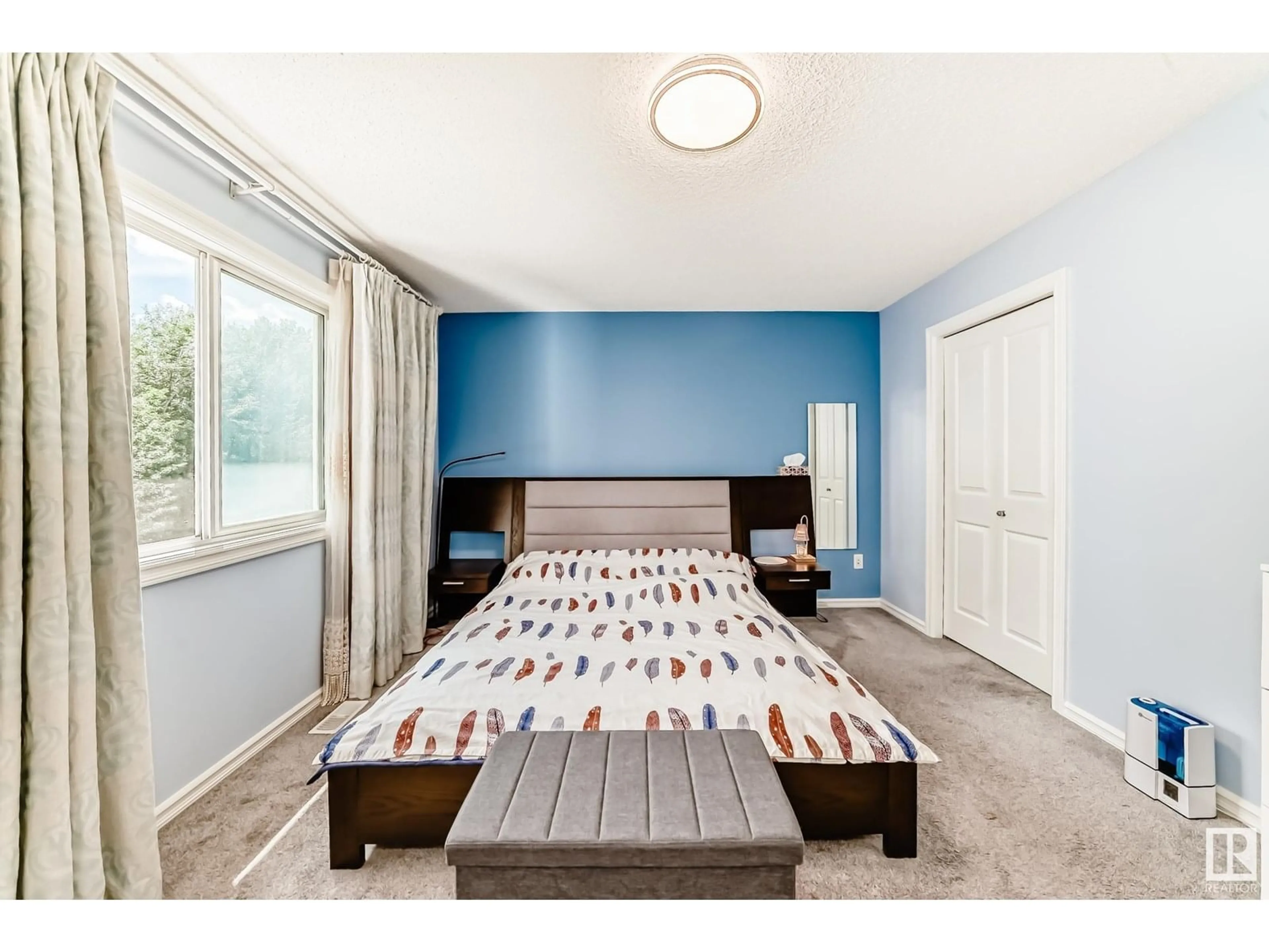Bedroom with bed, wood/laminate floor for 9107 205 ST NW, Edmonton Alberta T5T0X1