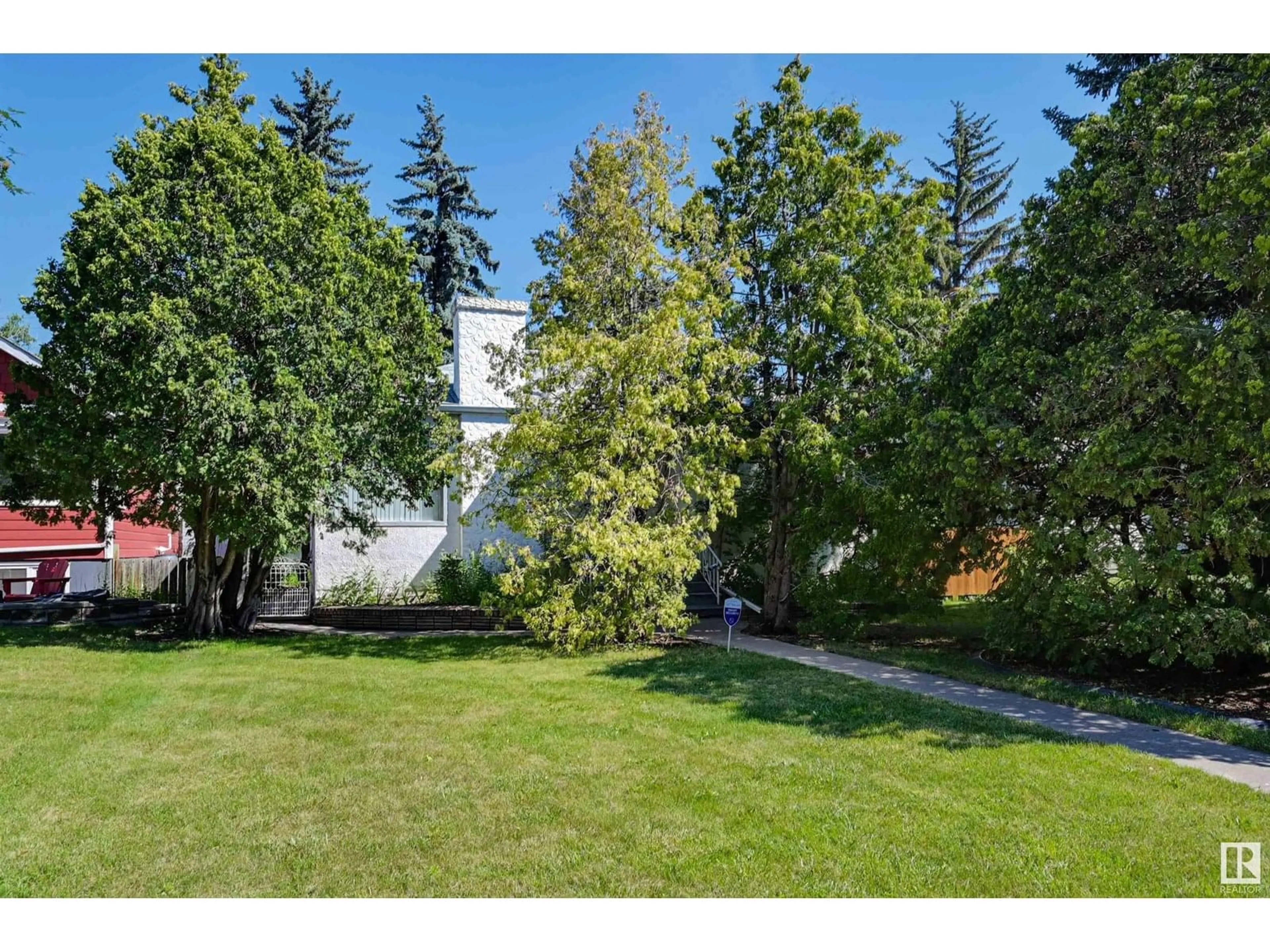 A pic from outside/outdoor area/front of a property/back of a property/a pic from drone, forest/trees view for NW - 11624 110A AV, Edmonton Alberta T5H1K6