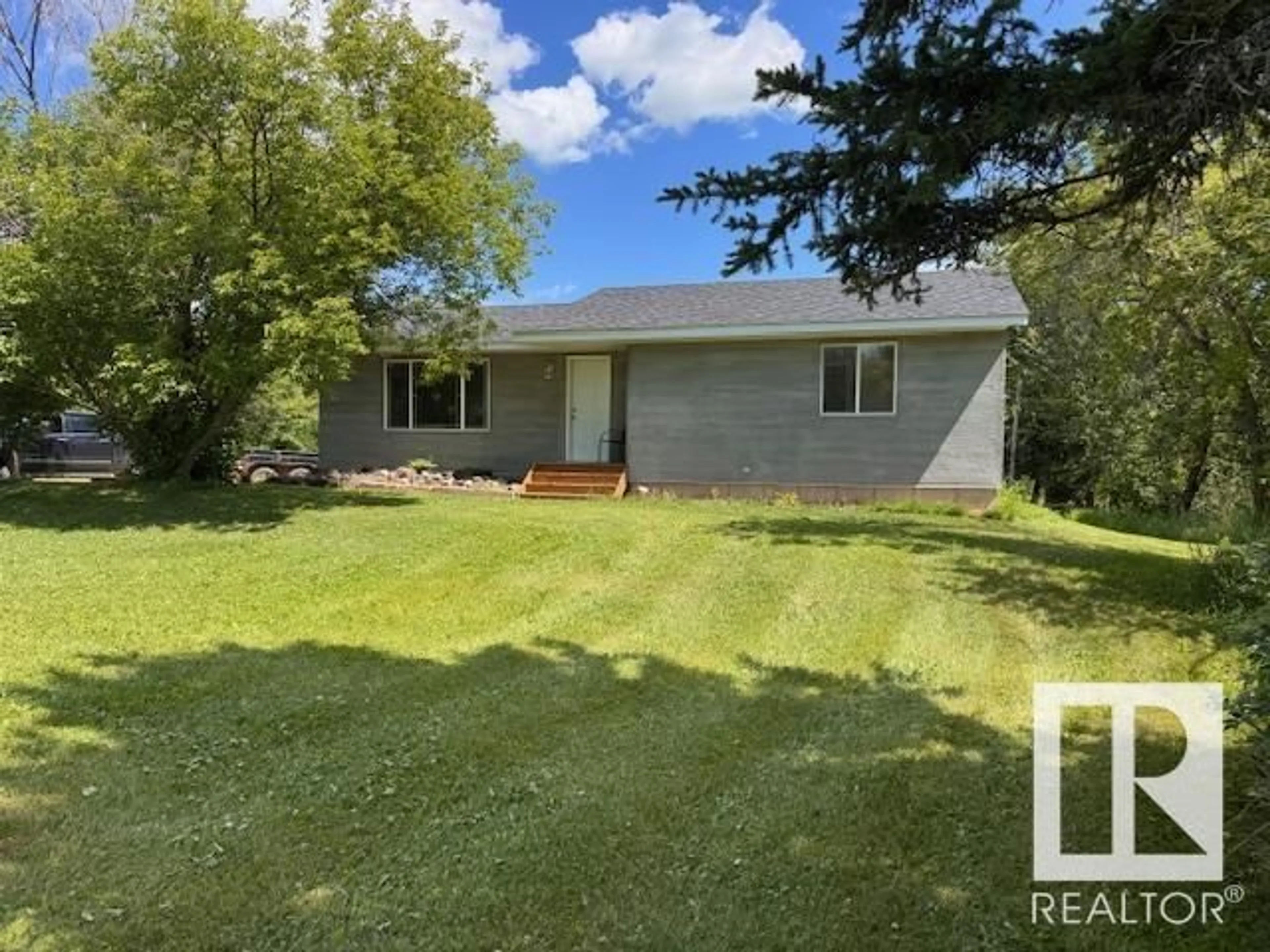 A pic from outside/outdoor area/front of a property/back of a property/a pic from drone, unknown for 61301 RR 50, Rural Barrhead County Alberta T0G0L0