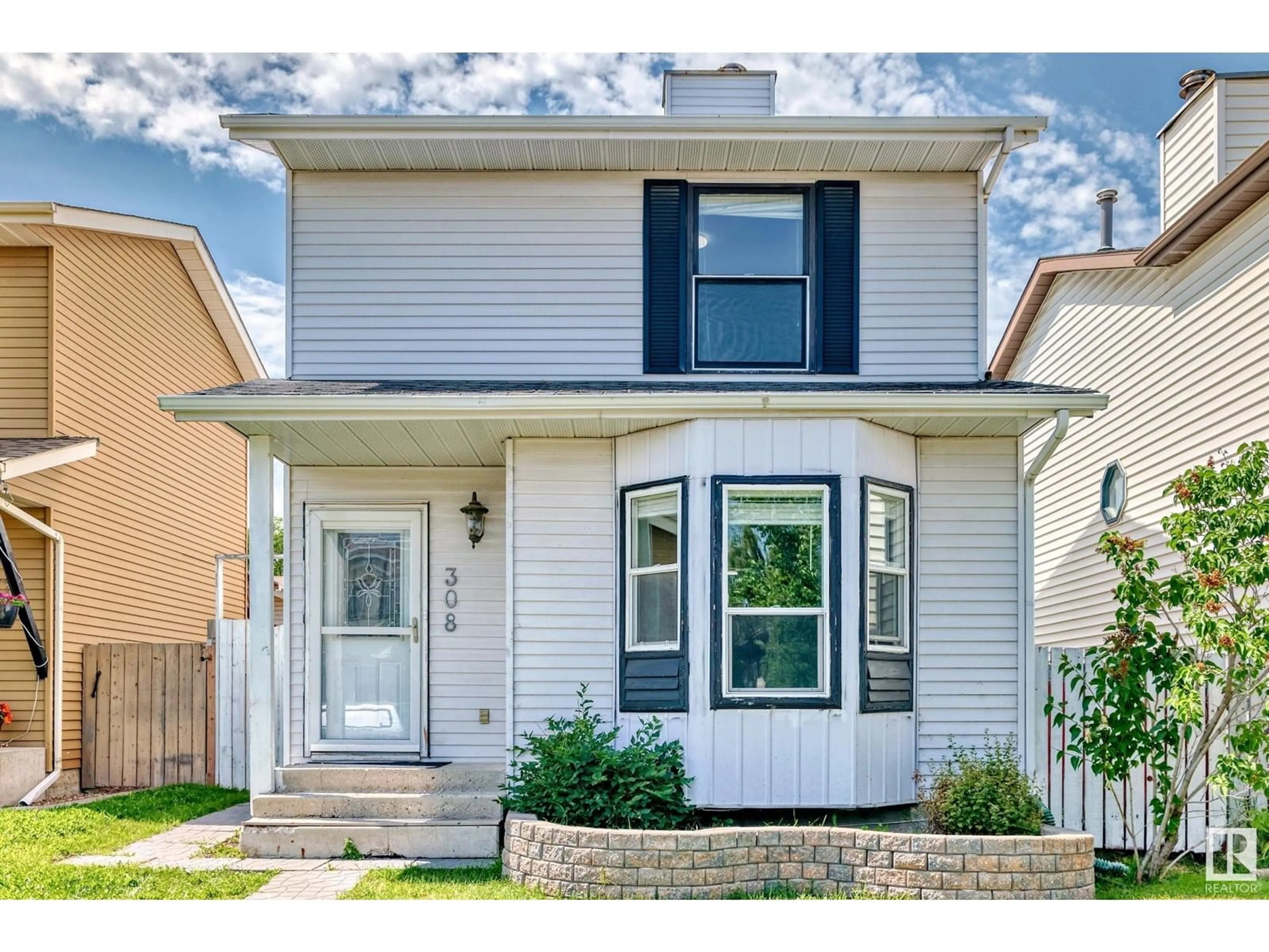 Home with vinyl exterior material, street for 308 KIRKPATRICK CR, Edmonton Alberta T6L5E1