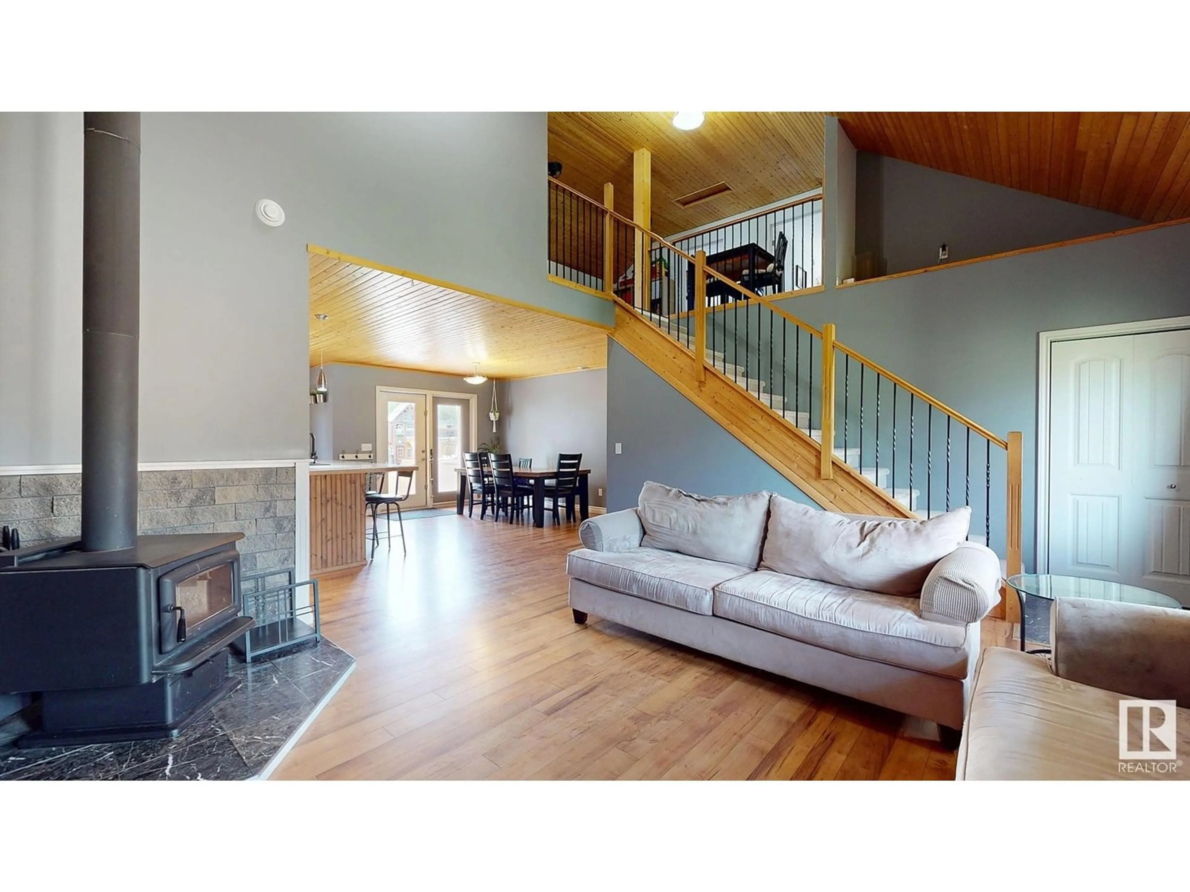 Living room with furniture, wood/laminate floor for 4215-43 AVENUE, Rural Lac Ste. Anne County Alberta T0E0A0