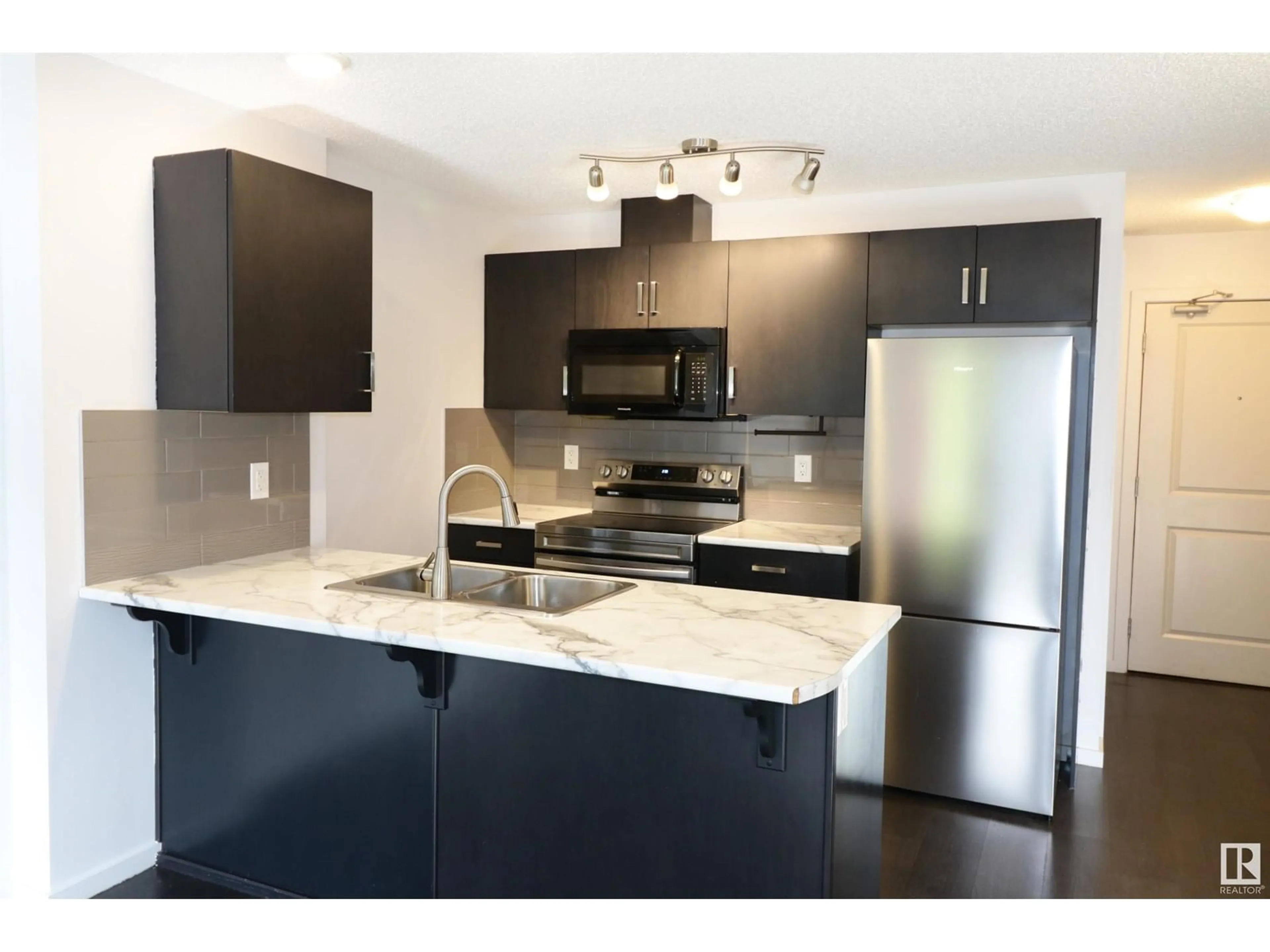 Open concept kitchen, unknown for 232 - 5515 7 AV SW, Edmonton Alberta T6X2A8