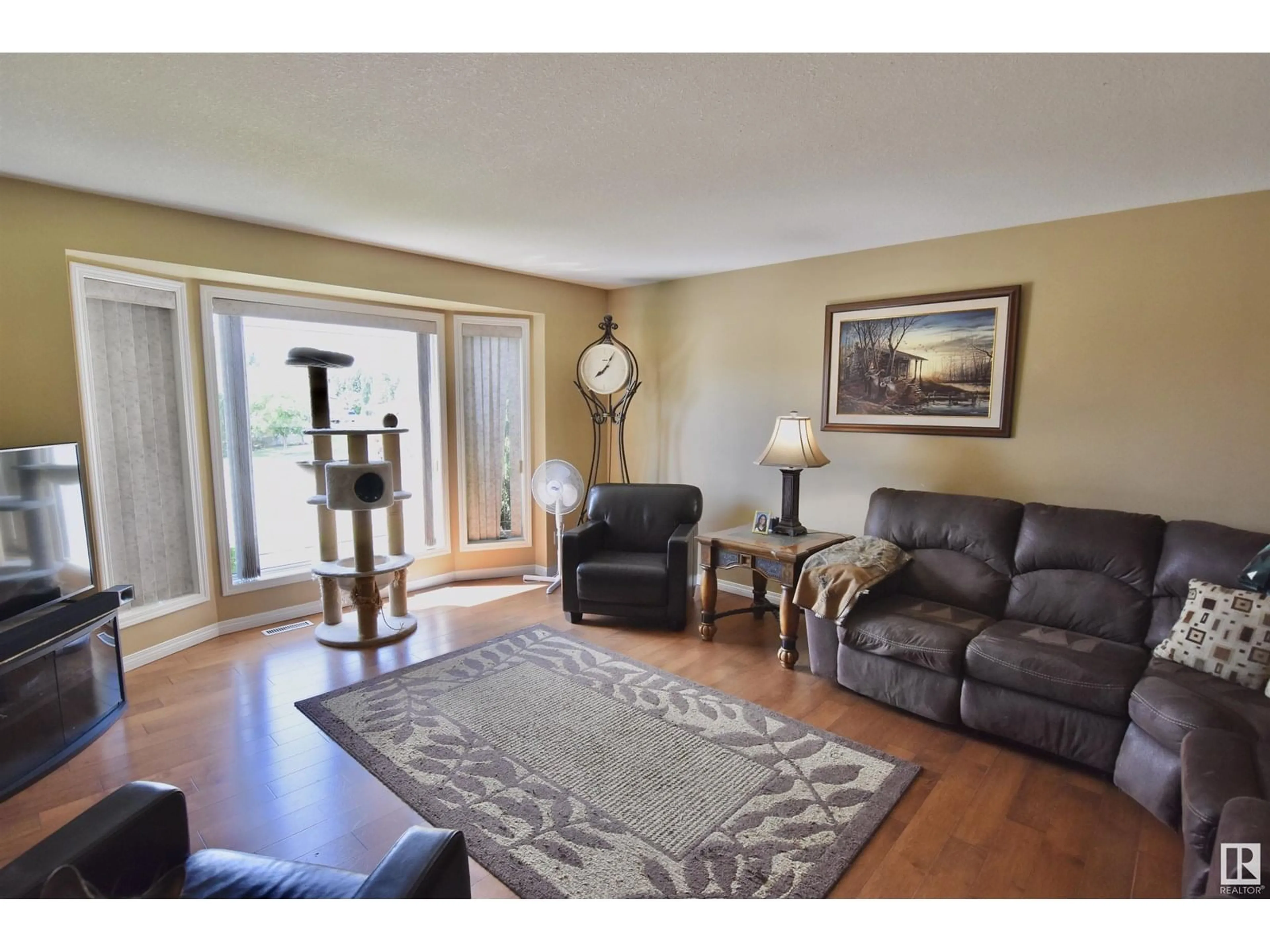 Living room with furniture, wood/laminate floor for 4426 59 ST, St. Paul Town Alberta T0A3A1