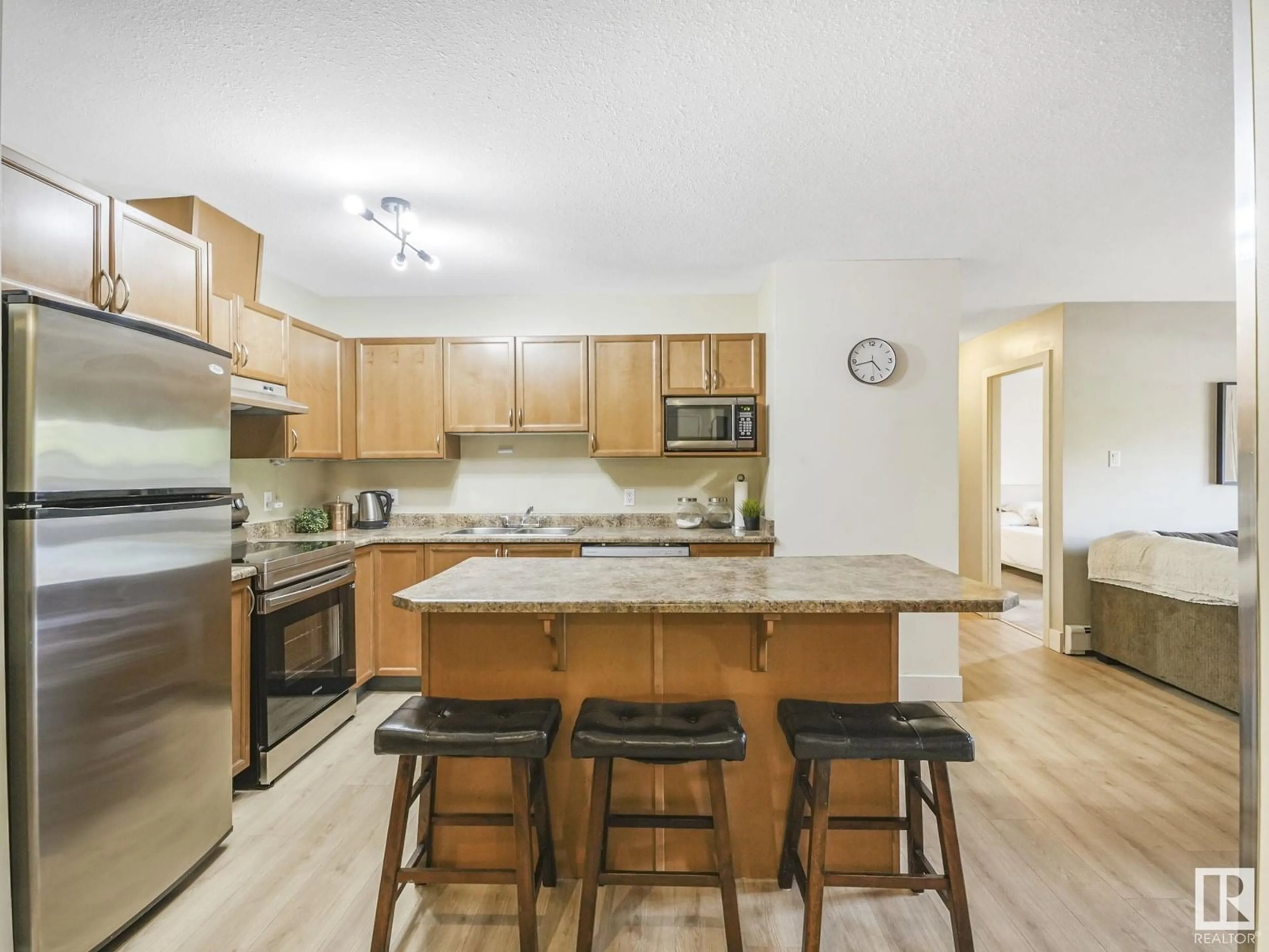 Open concept kitchen, wood/laminate floor for 102 - 9715 110 ST NW, Edmonton Alberta T5K2M1
