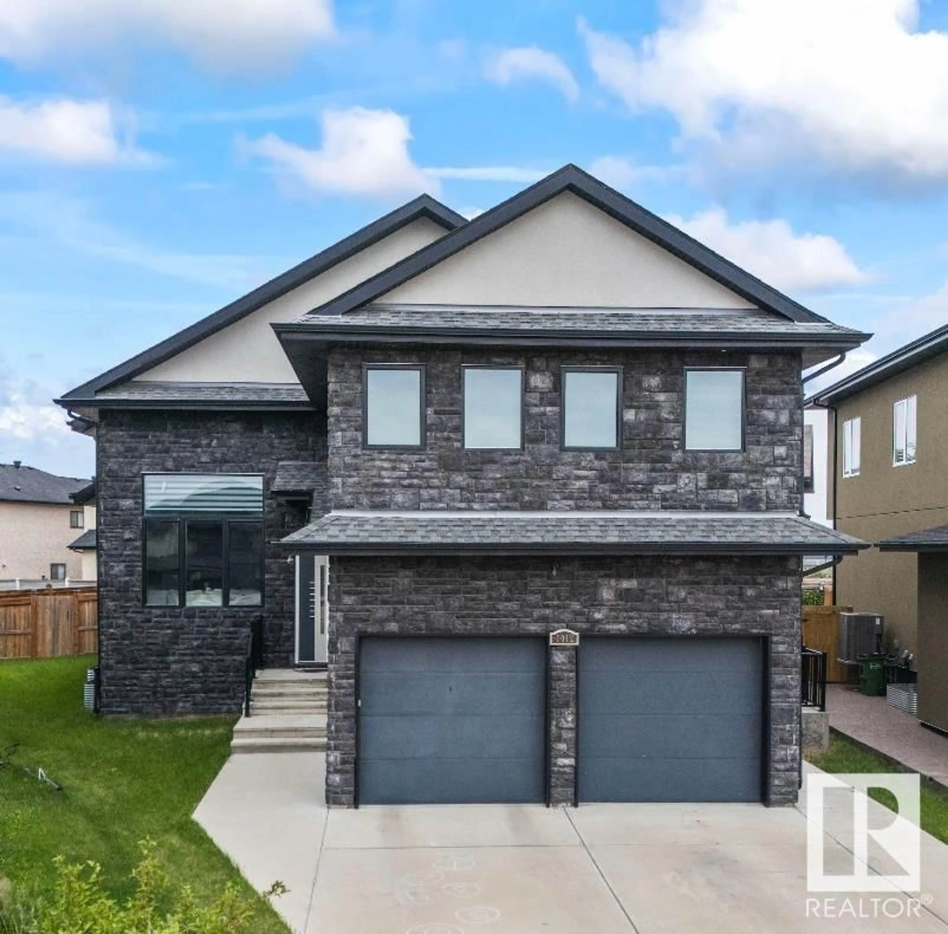 Home with brick exterior material, street for 1012 148 AV, Edmonton Alberta T5Z0V4