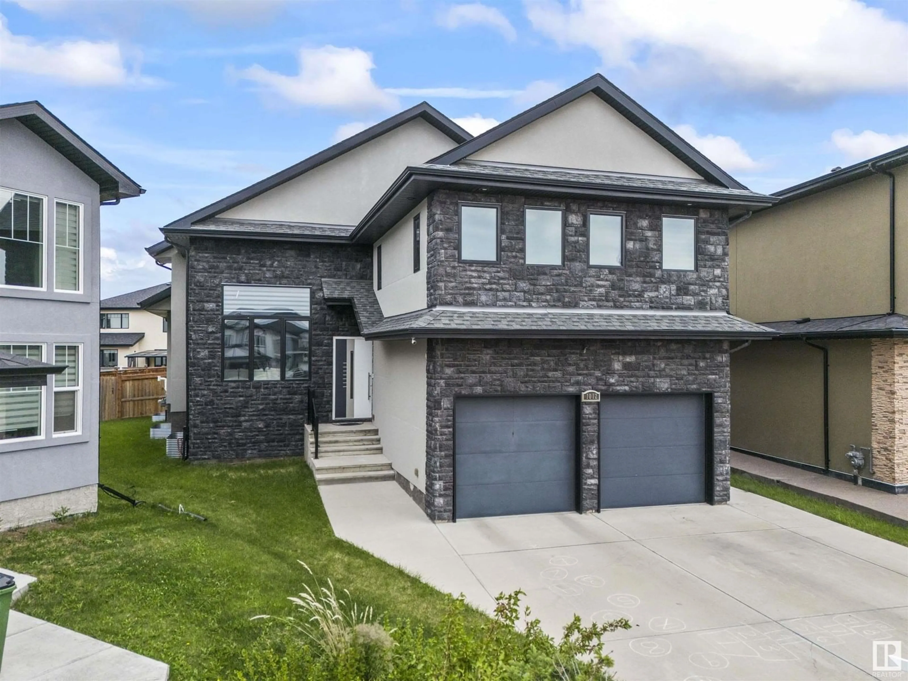Home with brick exterior material, street for 1012 148 AV, Edmonton Alberta T5Z0V4