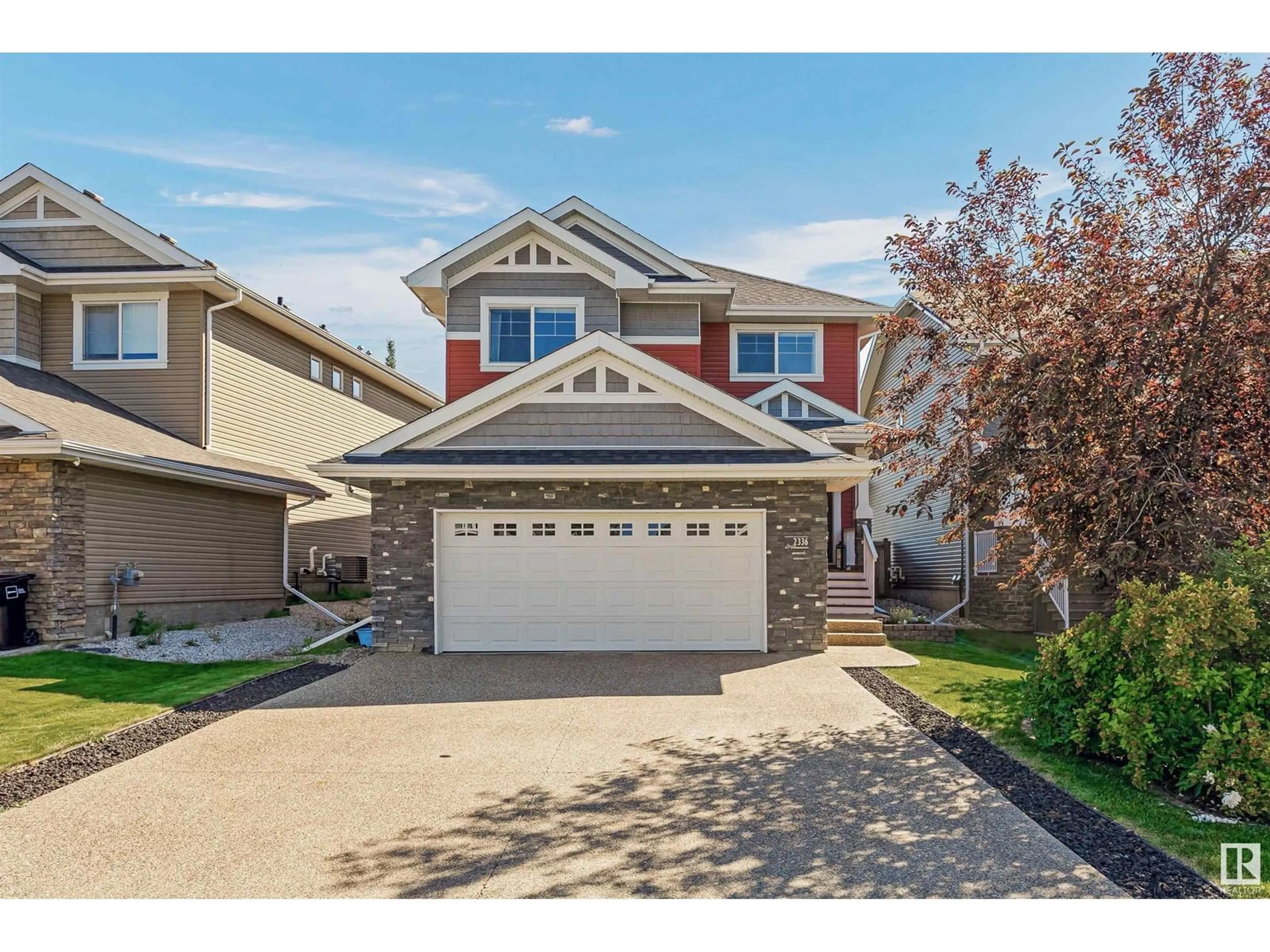 Home with vinyl exterior material, street for 2336 SPARROW CR, Edmonton Alberta T5S0G8