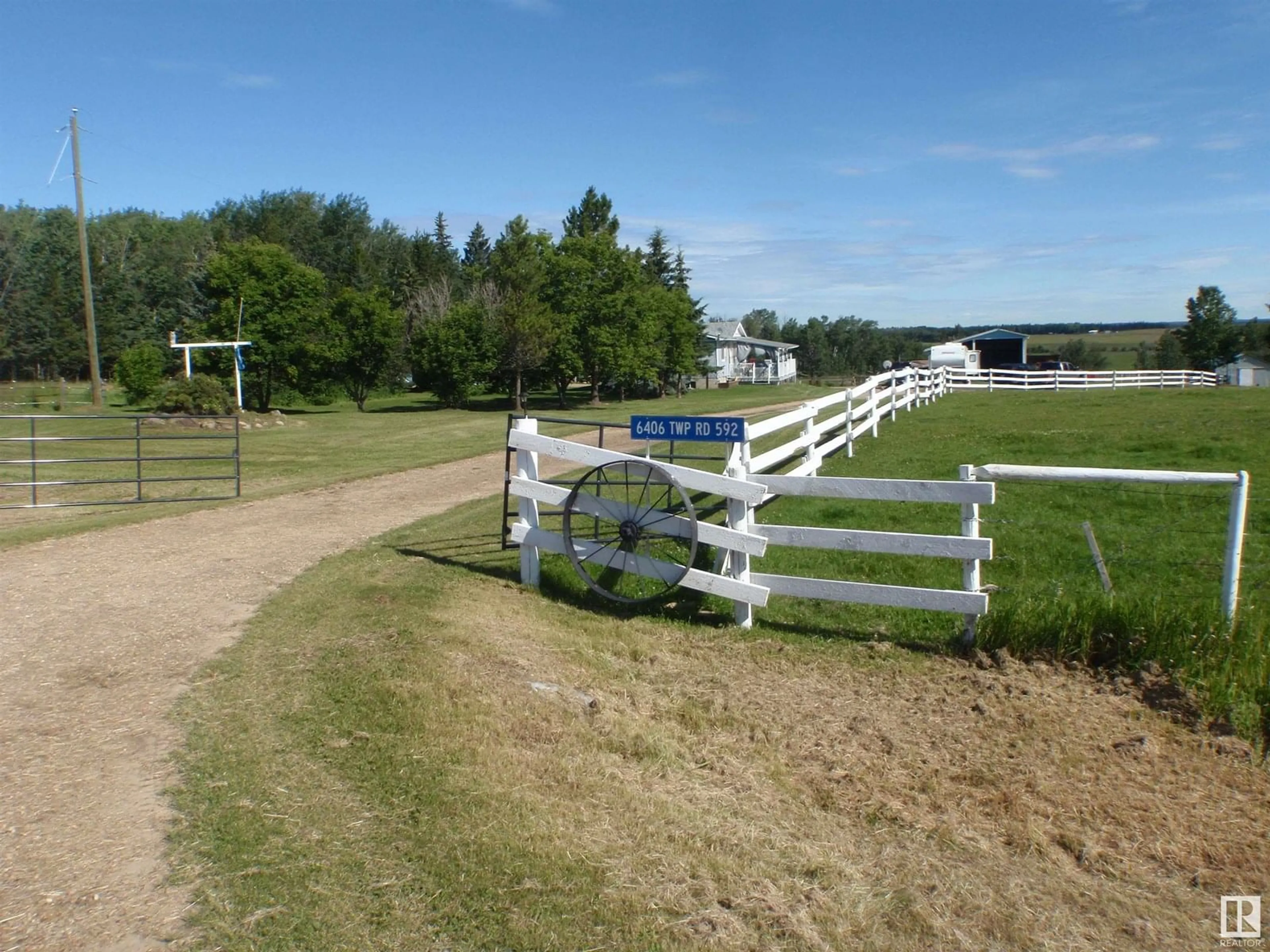 A pic from outside/outdoor area/front of a property/back of a property/a pic from drone, unknown for 6406 TWP RD 592, Rural Lac Ste. Anne County Alberta T0E2A0
