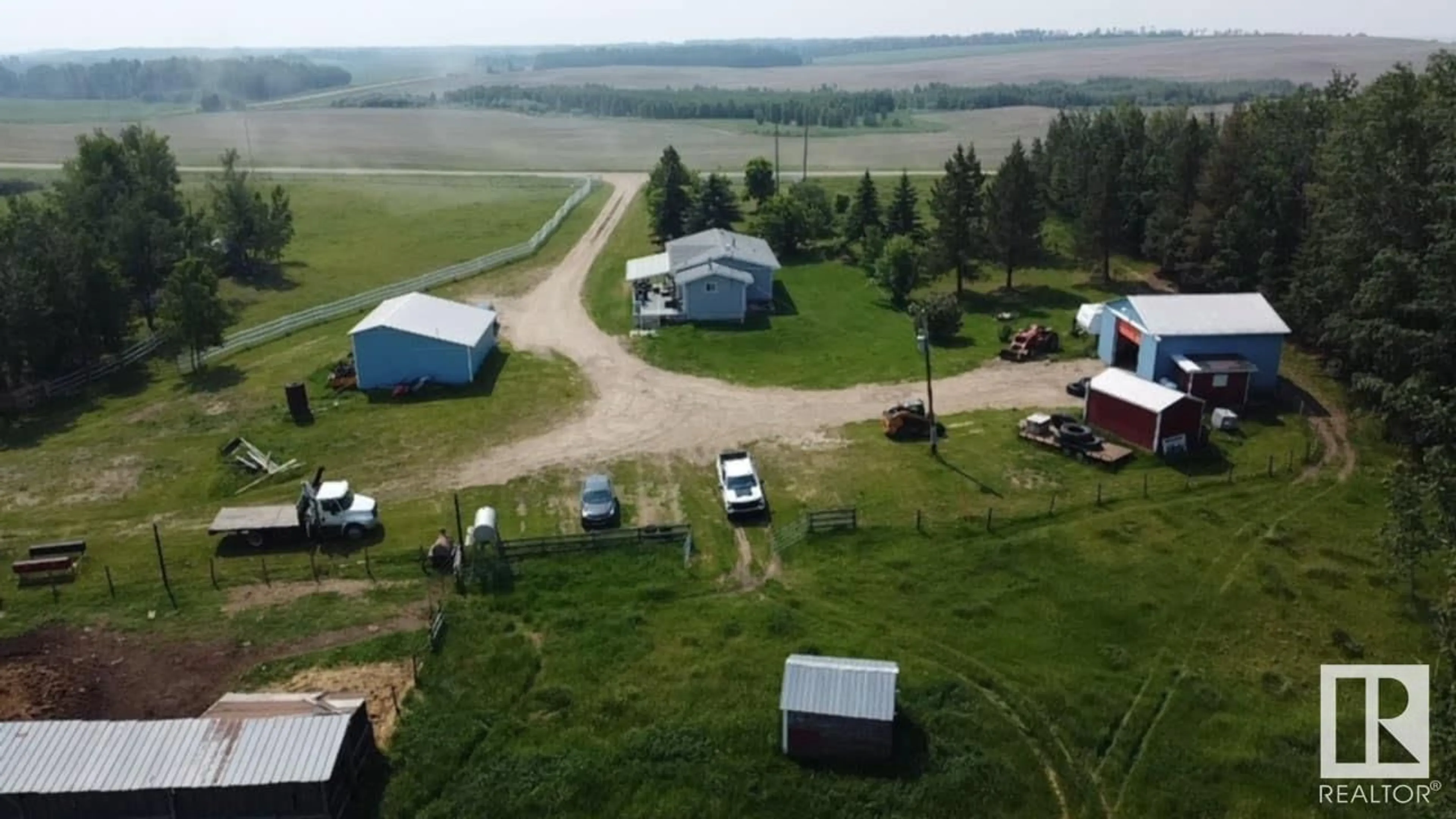 A pic from outside/outdoor area/front of a property/back of a property/a pic from drone, unknown for 6406 TWP RD 592, Rural Lac Ste. Anne County Alberta T0E2A0