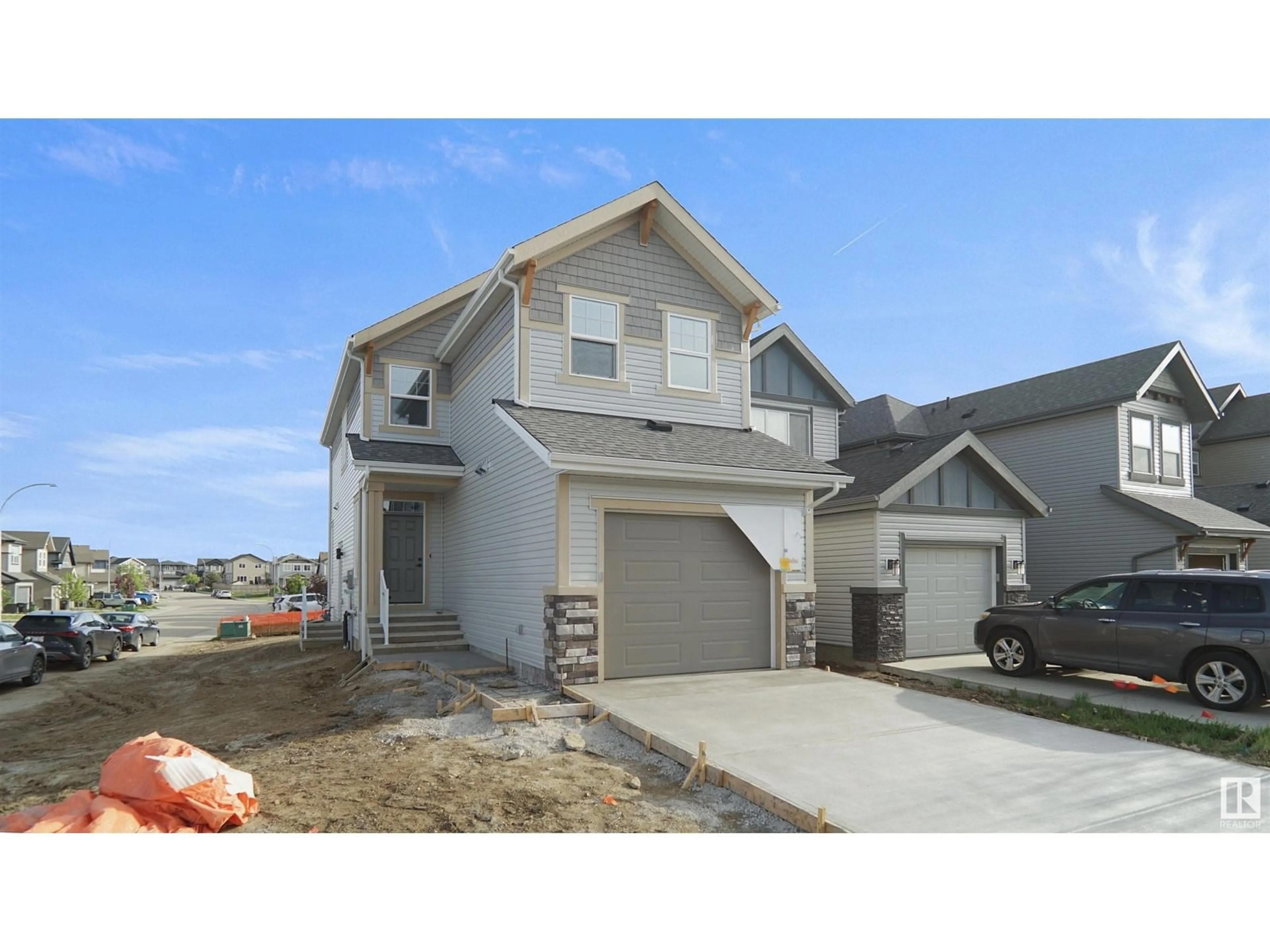 Home with vinyl exterior material, street for 22830 95A AV, Edmonton Alberta T5T7H5