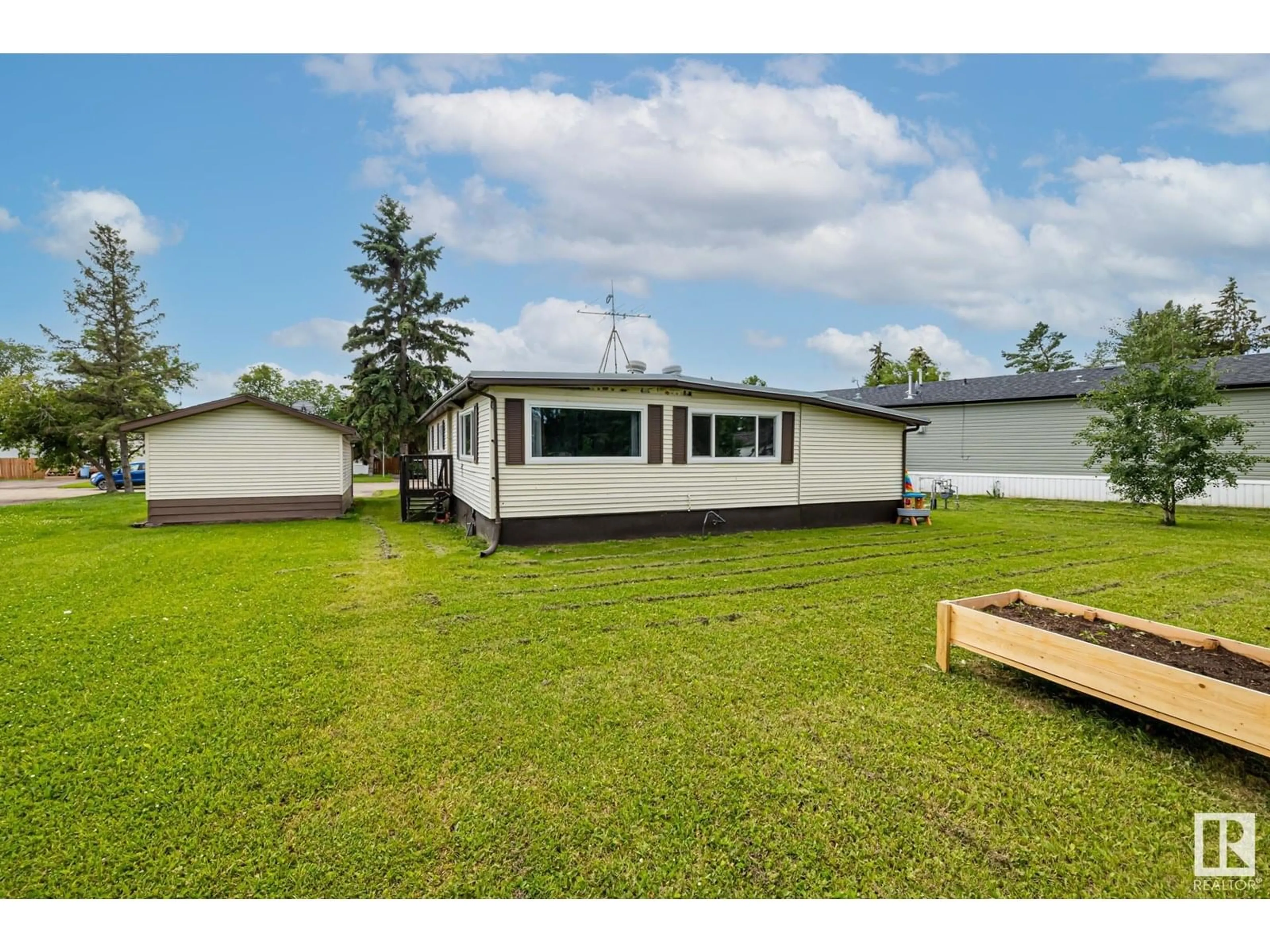 A pic from outside/outdoor area/front of a property/back of a property/a pic from drone, water/lake/river/ocean view for 41 - 4850 CENTRE ST, New Sarepta Alberta T0B3M0