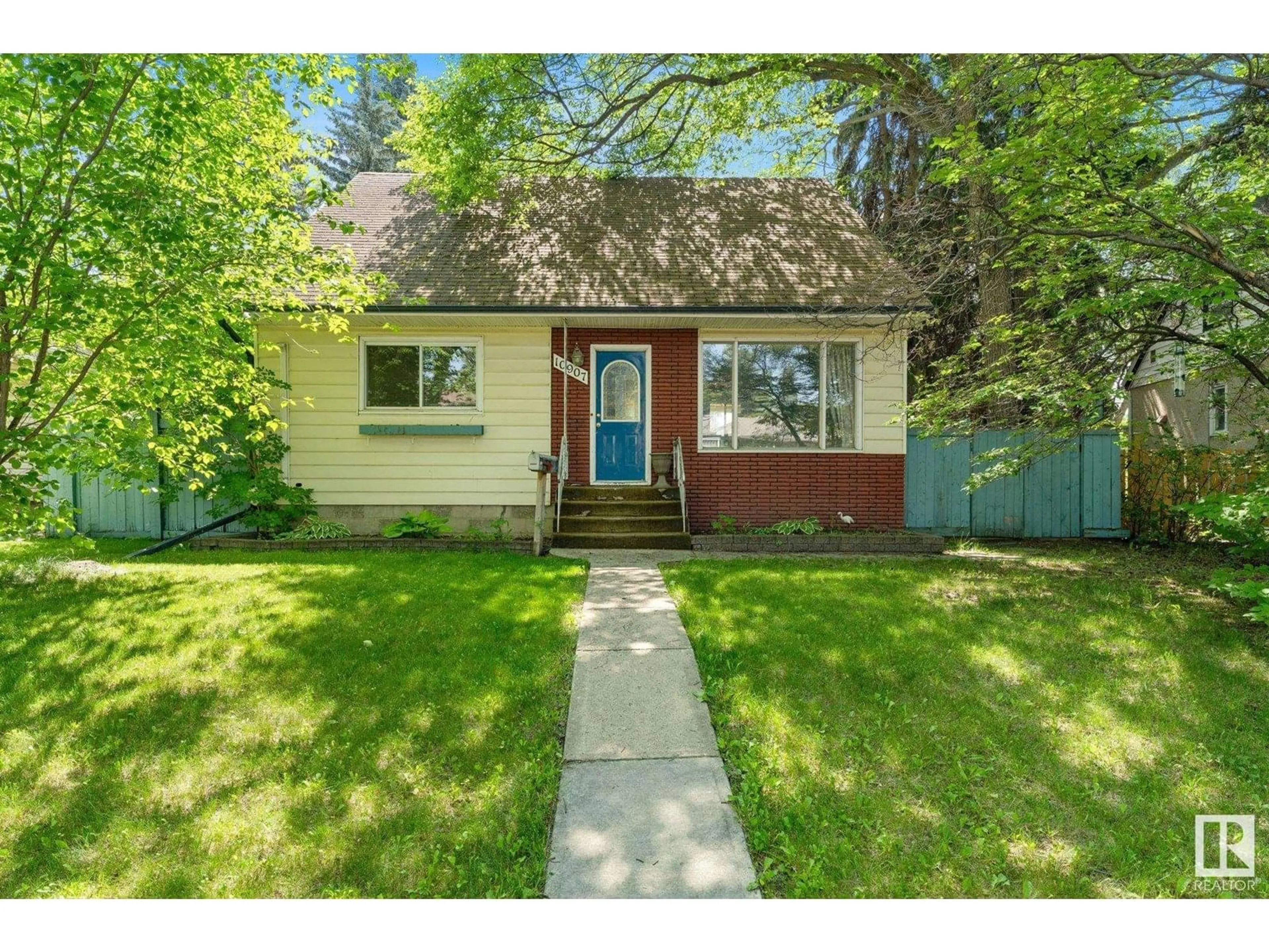 Home with vinyl exterior material, street for NW - 10907 62 AV, Edmonton Alberta T6H1N3