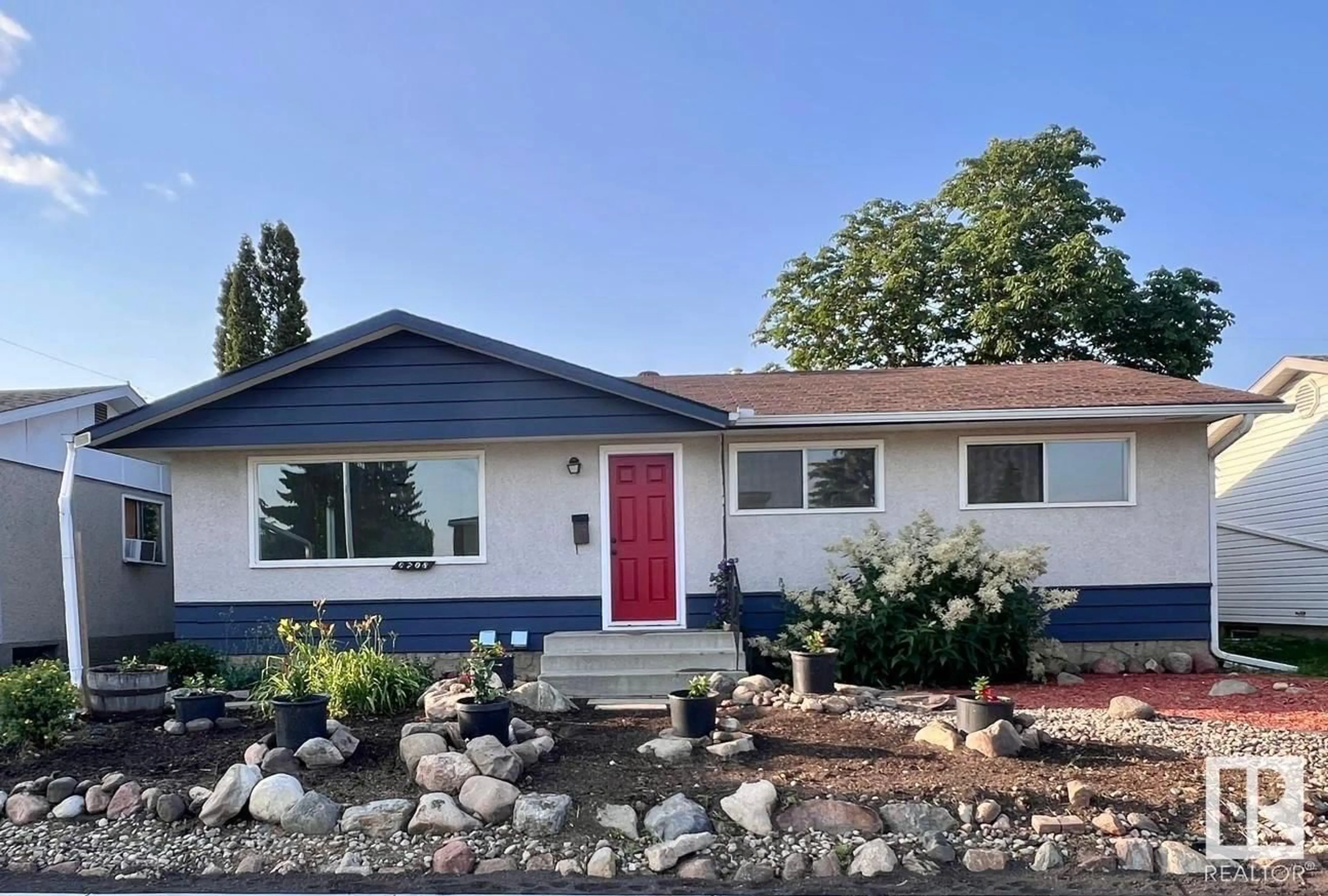 Home with vinyl exterior material, street for 6708 132 AV, Edmonton Alberta T5C2A5