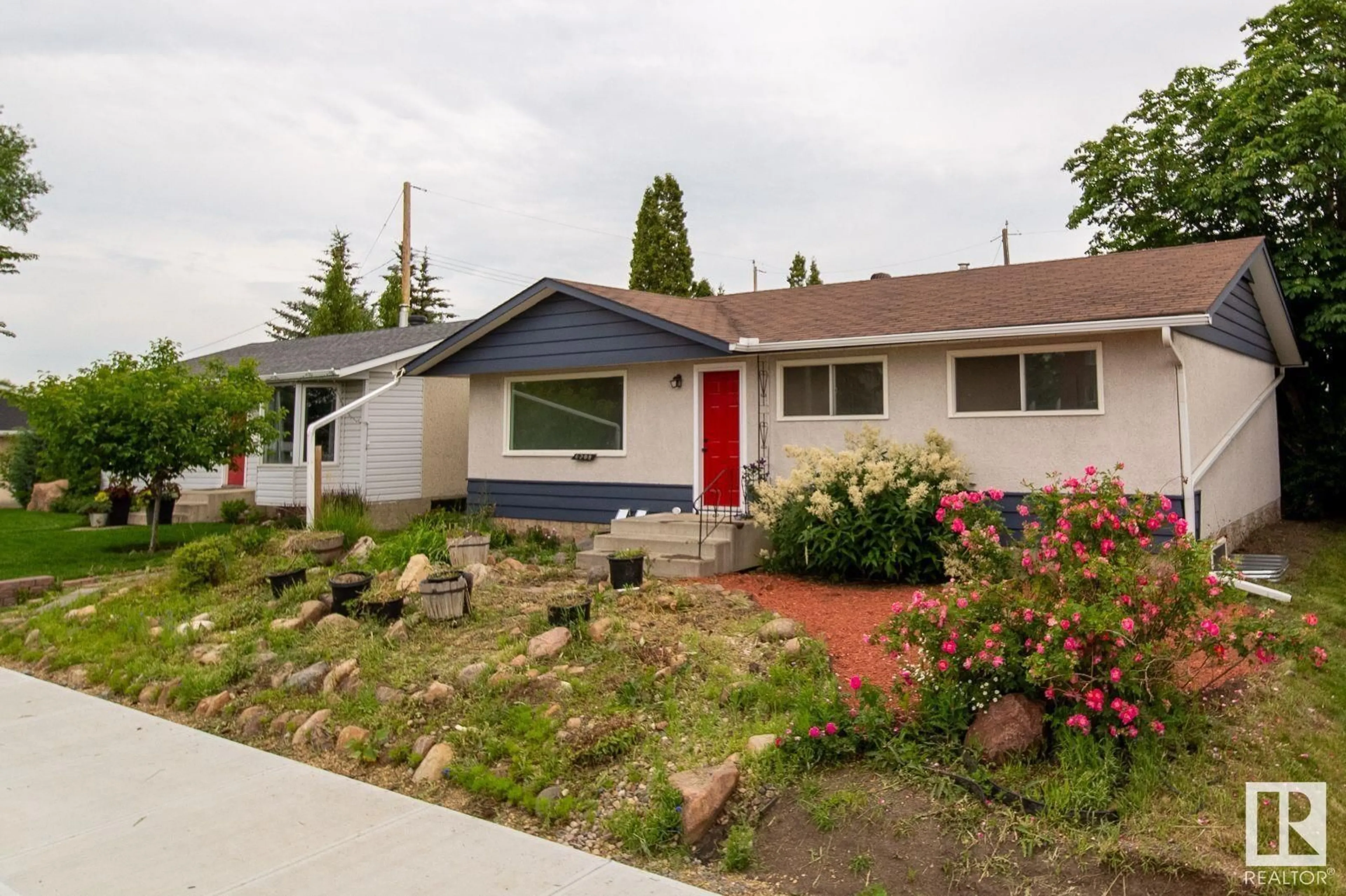 Home with vinyl exterior material, street for 6708 132 AV, Edmonton Alberta T5C2A5