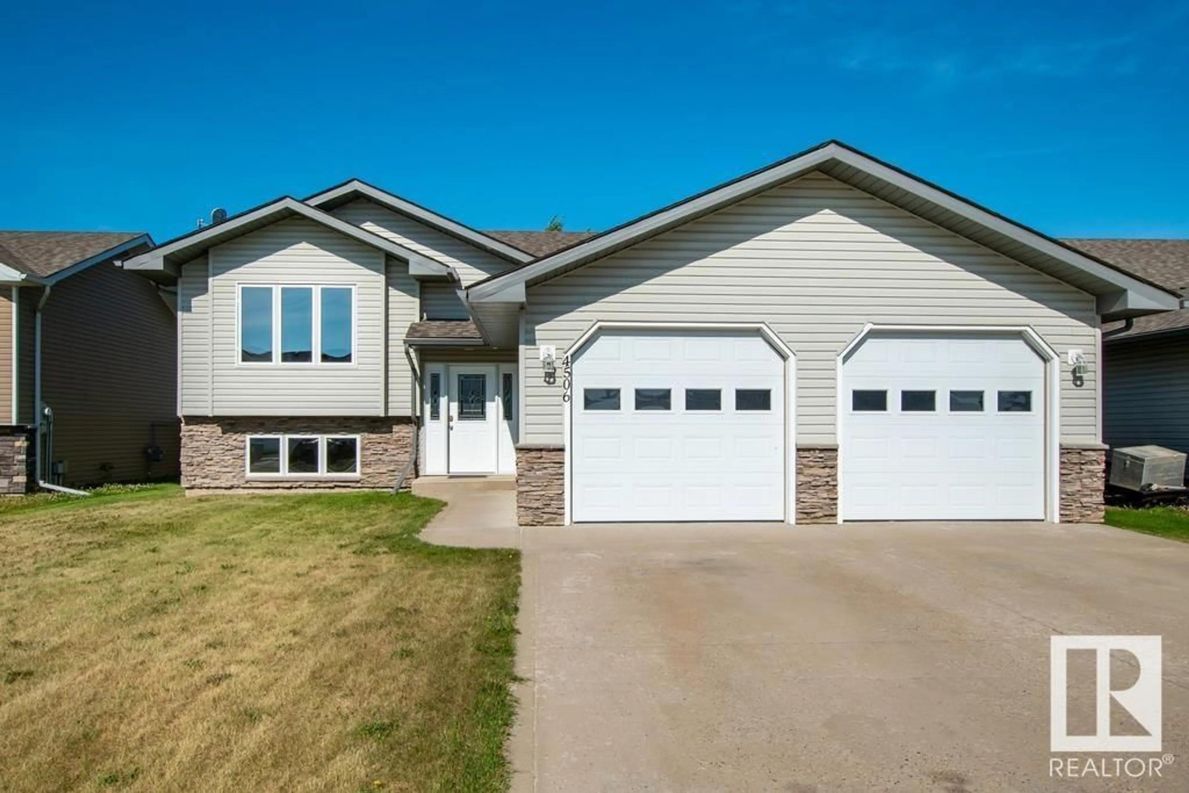 Home with vinyl exterior material, street for 4506 38A ST, Bonnyville Town Alberta T9N2P4