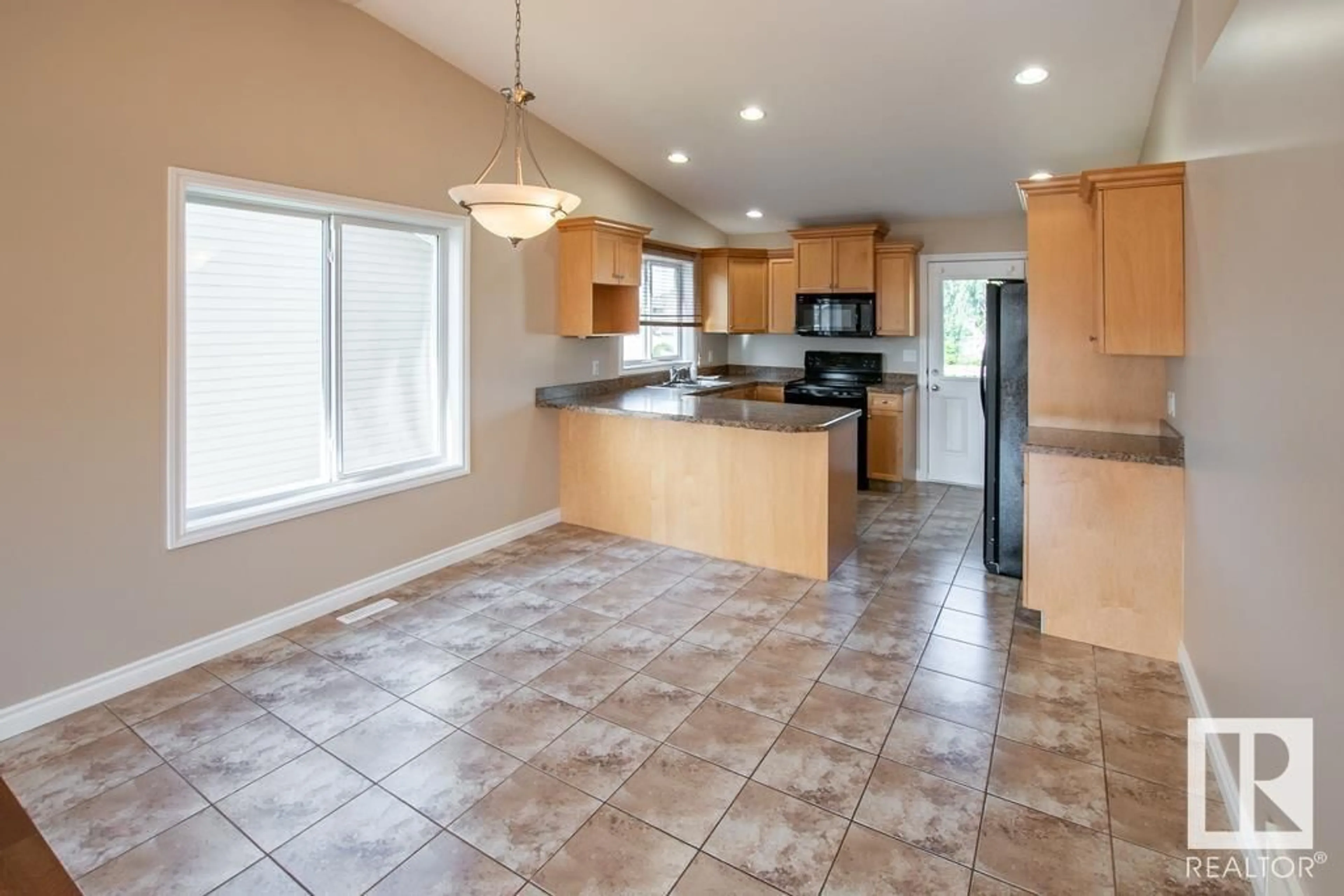 Open concept kitchen, ceramic/tile floor for 4506 38A ST, Bonnyville Town Alberta T9N2P4