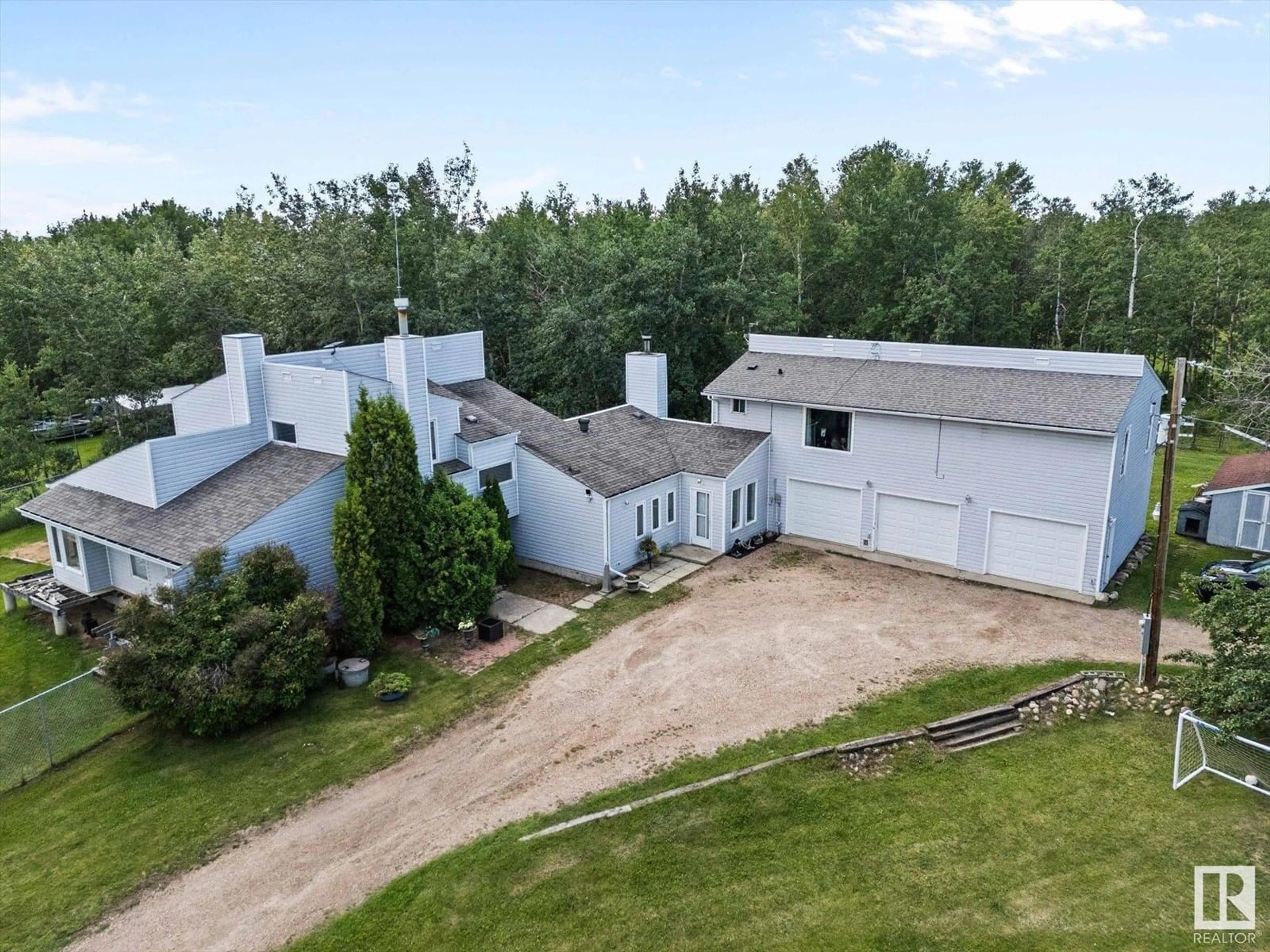 A pic from outside/outdoor area/front of a property/back of a property/a pic from drone, building for 20339 TWP ROAD 550, Rural Strathcona County Alberta T8L4B6