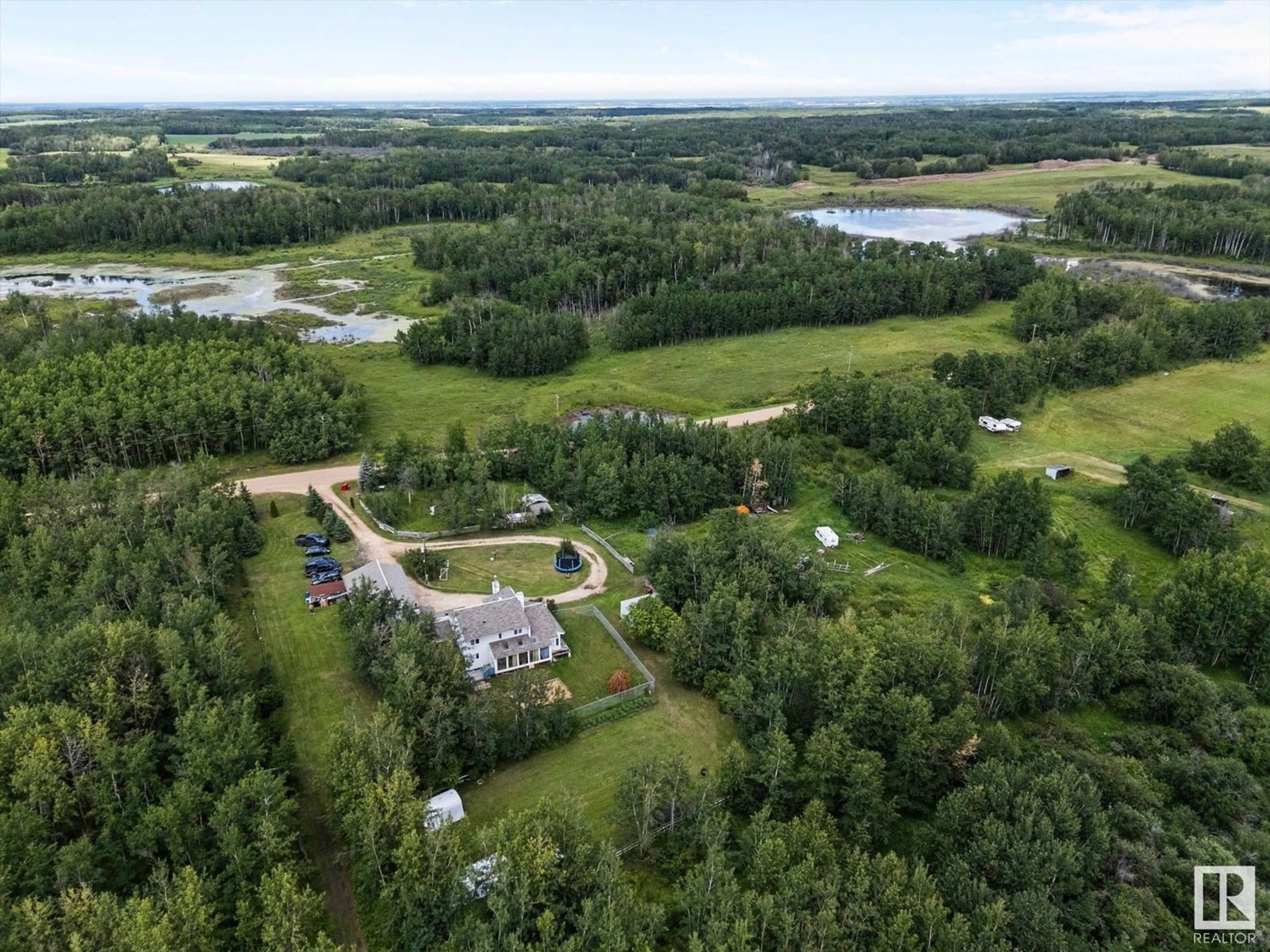 A pic from outside/outdoor area/front of a property/back of a property/a pic from drone, water/lake/river/ocean view for 20339 TWP ROAD 550, Rural Strathcona County Alberta T8L4B6