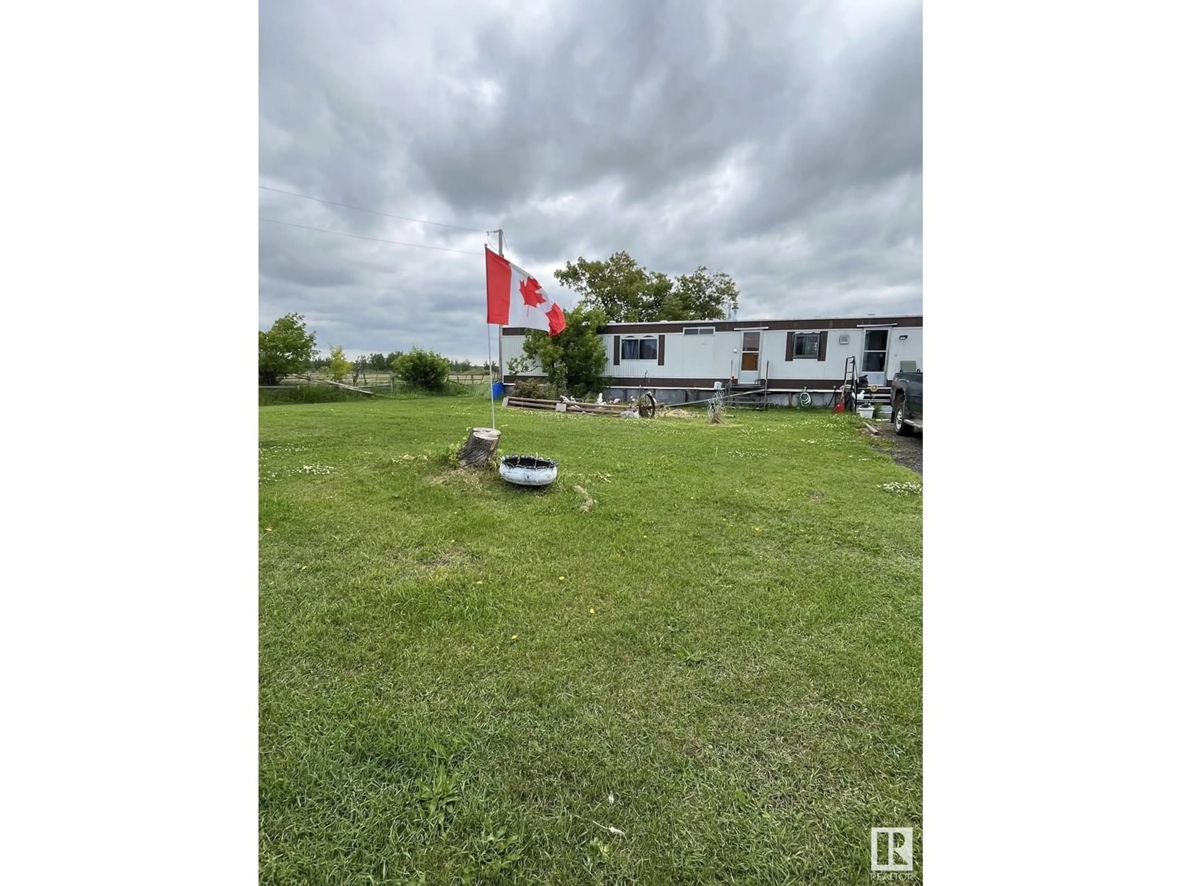 A pic from outside/outdoor area/front of a property/back of a property/a pic from drone, unknown for 56519A HWY 33, Rural Lac Ste. Anne County Alberta T0E1X0