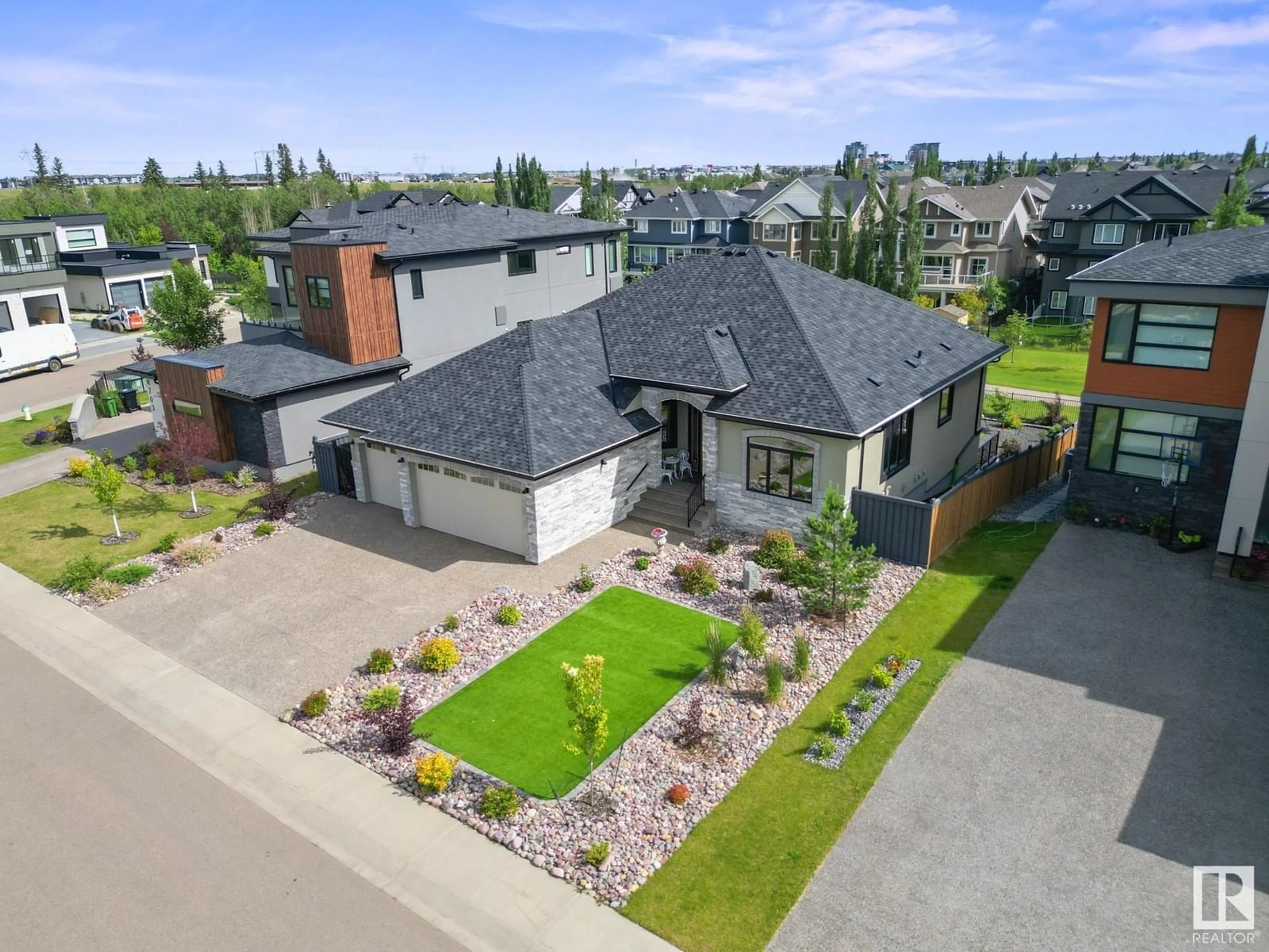 A pic from outside/outdoor area/front of a property/back of a property/a pic from drone, street for NW - 4707 WOOLSEY CM, Edmonton Alberta T6W2E2