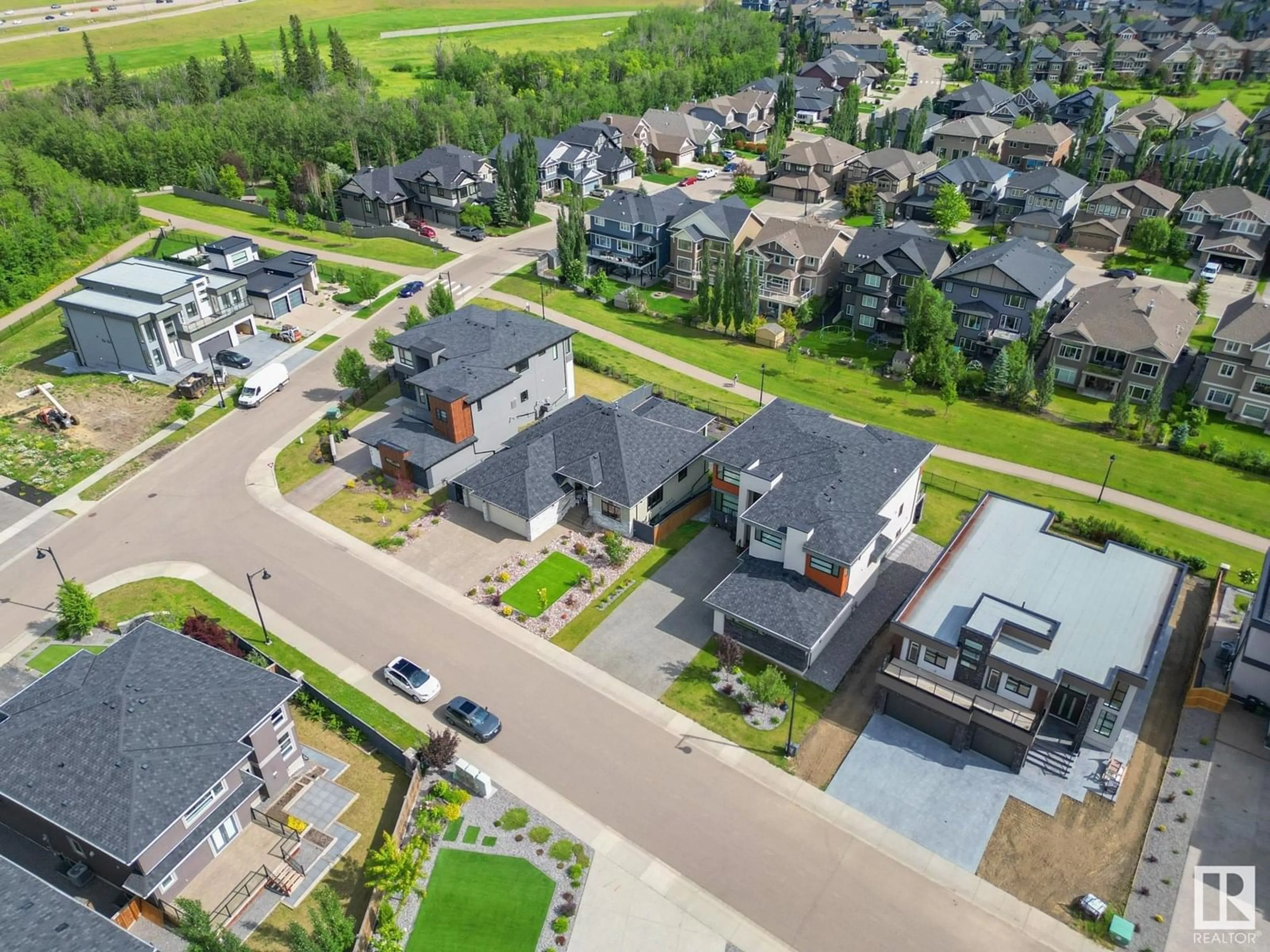 A pic from outside/outdoor area/front of a property/back of a property/a pic from drone, street for NW - 4707 WOOLSEY CM, Edmonton Alberta T6W2E2