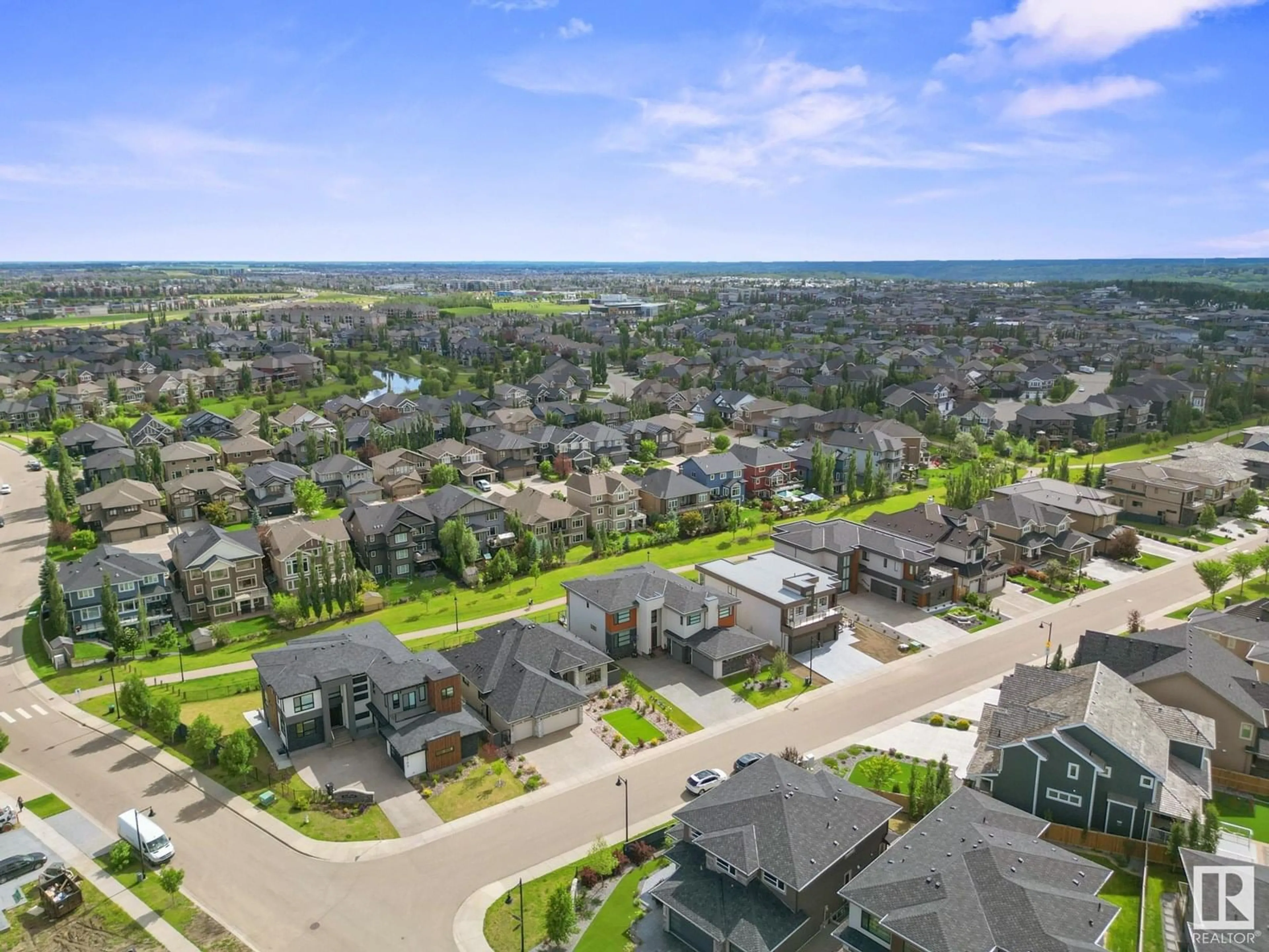 A pic from outside/outdoor area/front of a property/back of a property/a pic from drone, street for NW - 4707 WOOLSEY CM, Edmonton Alberta T6W2E2