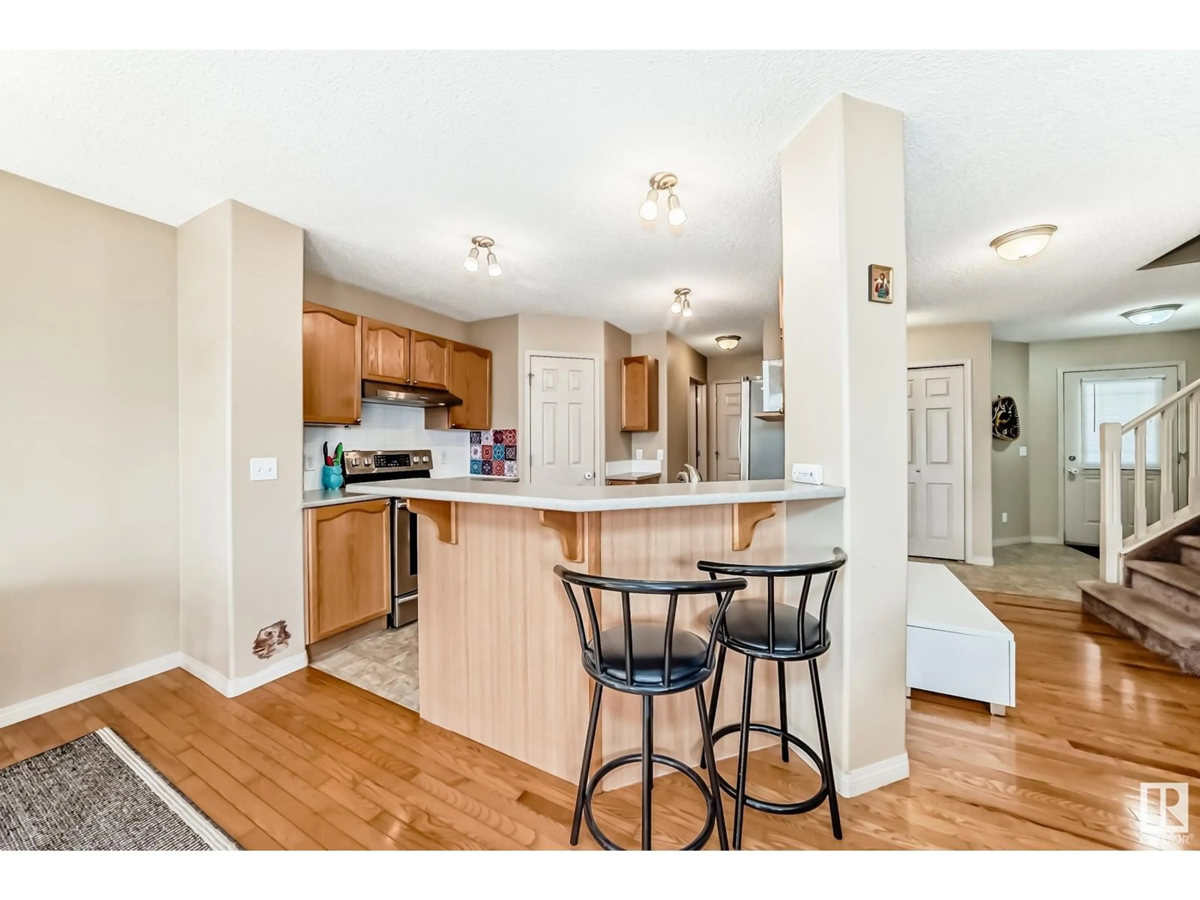 Open concept kitchen, wood/laminate floor for 155 - 52 CROCUS CR, Sherwood Park Alberta T8H2M4