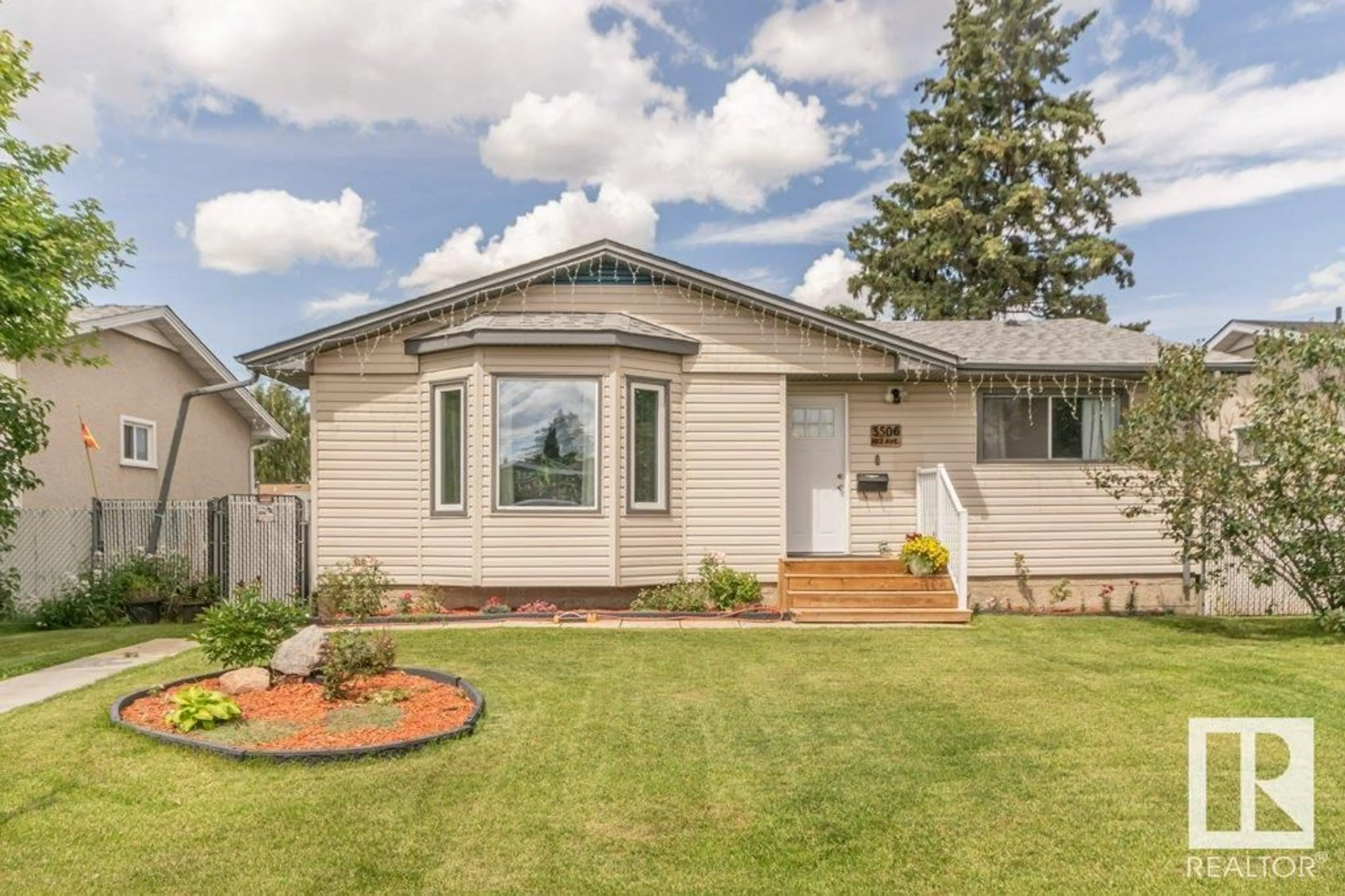 Home with vinyl exterior material, street for NW - 3506 122 AV, Edmonton Alberta T5W1P8