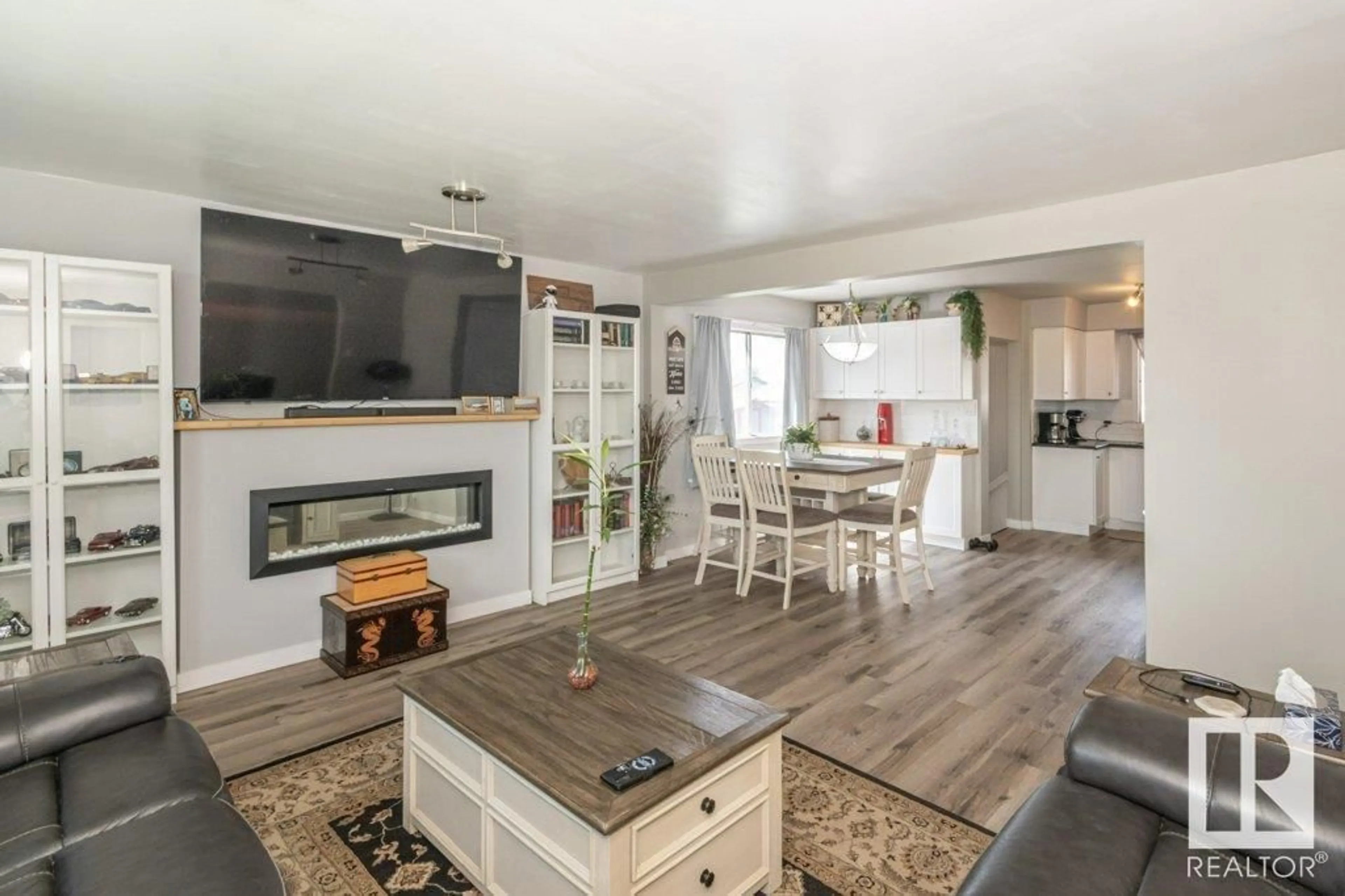 Living room with furniture, wood/laminate floor for NW - 3506 122 AV, Edmonton Alberta T5W1P8