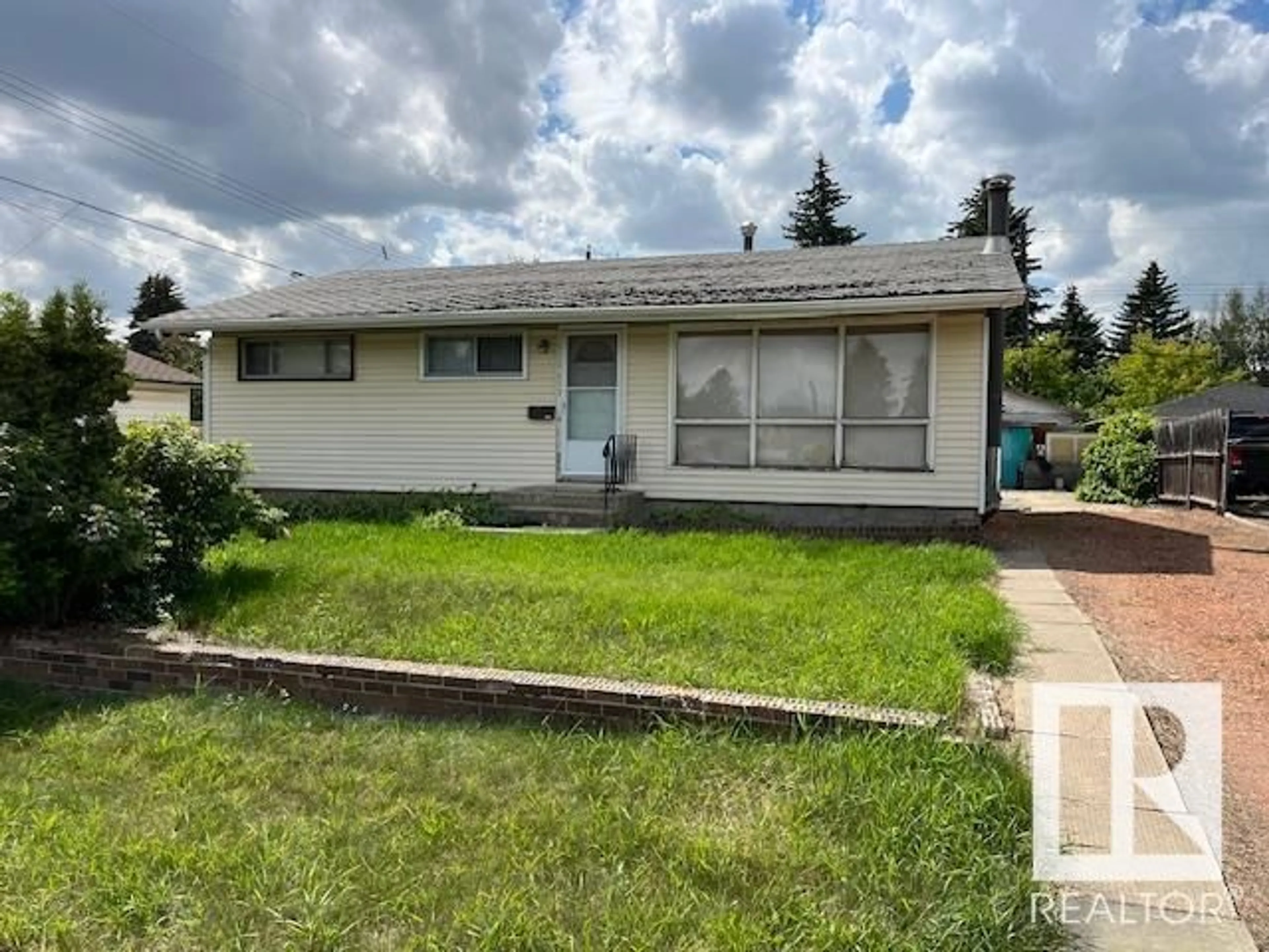 Home with vinyl exterior material, street for 13308 137 ST, Edmonton Alberta T5L2A9