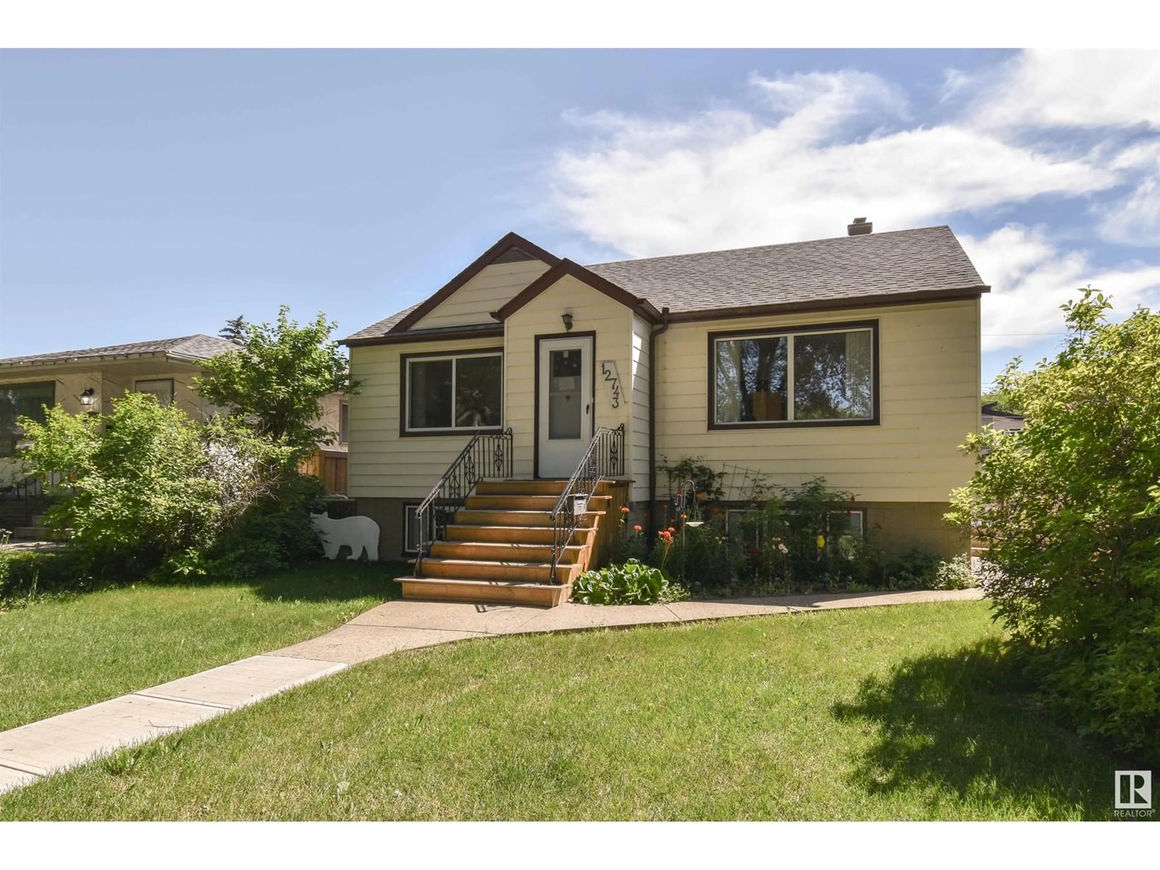 Home with vinyl exterior material, street for 12743 118 ST, Edmonton Alberta T5E5K9
