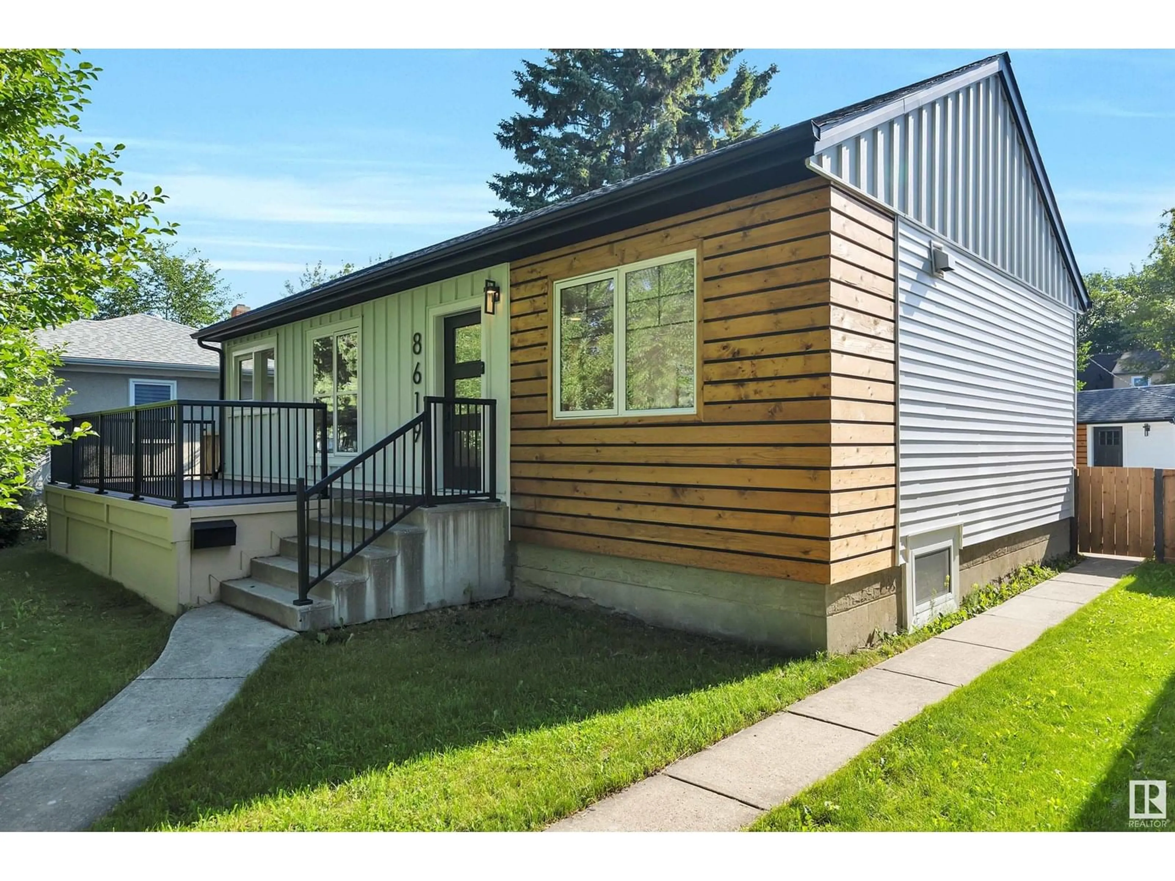 Home with vinyl exterior material, street for 8619 80 ST, Edmonton Alberta T6C2S8