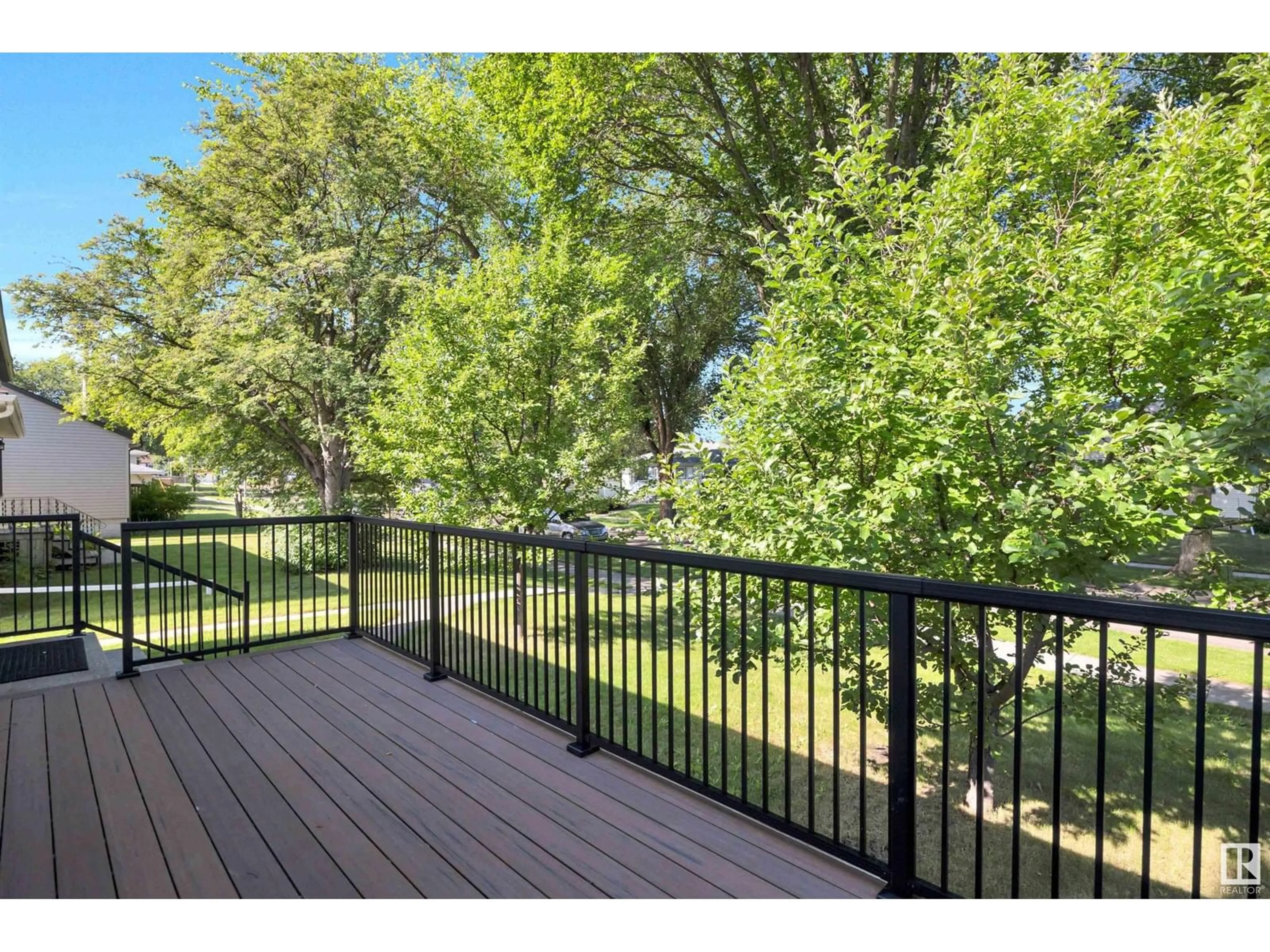 Patio, forest/trees view for 8619 80 ST, Edmonton Alberta T6C2S8