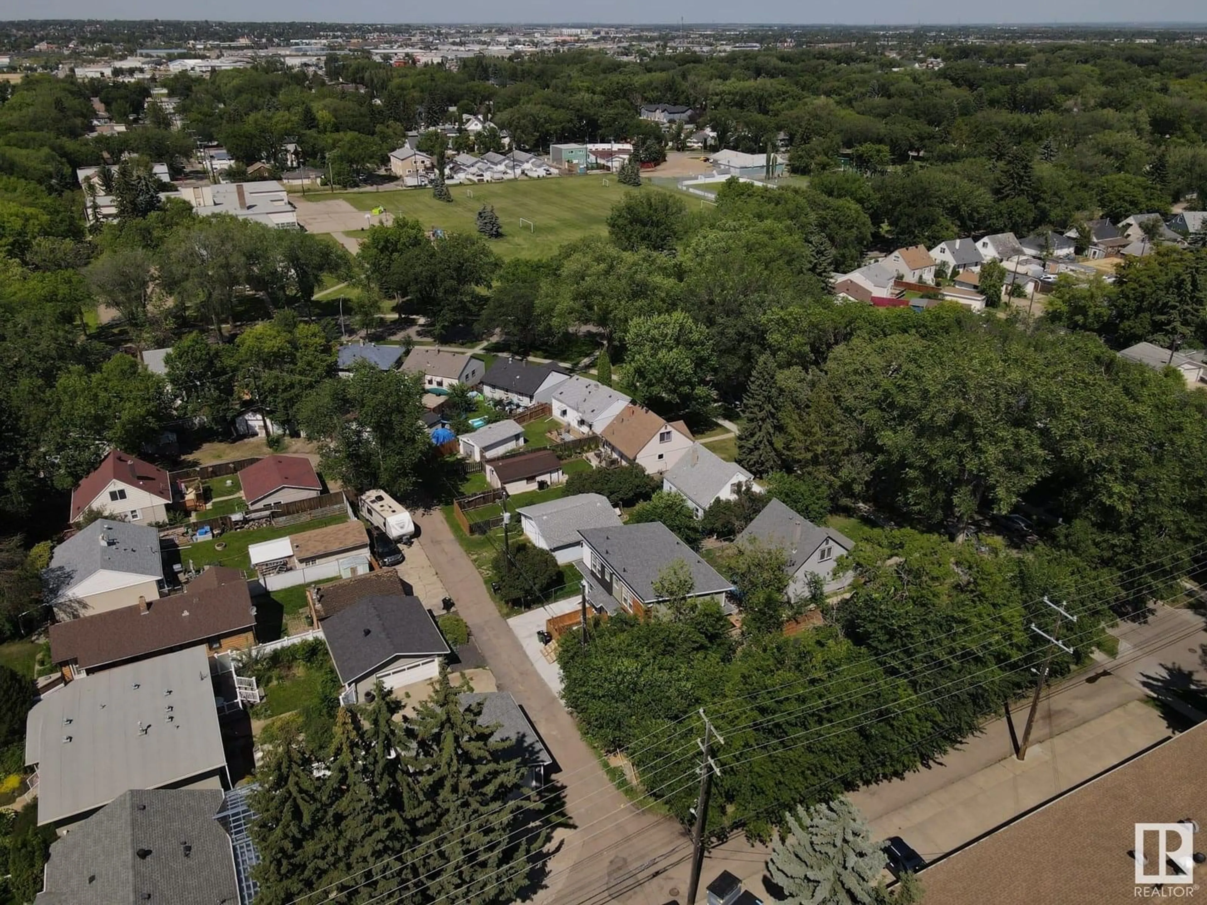 A pic from outside/outdoor area/front of a property/back of a property/a pic from drone, street for #1 - 6120 118 AV, Edmonton Alberta T5W1E8