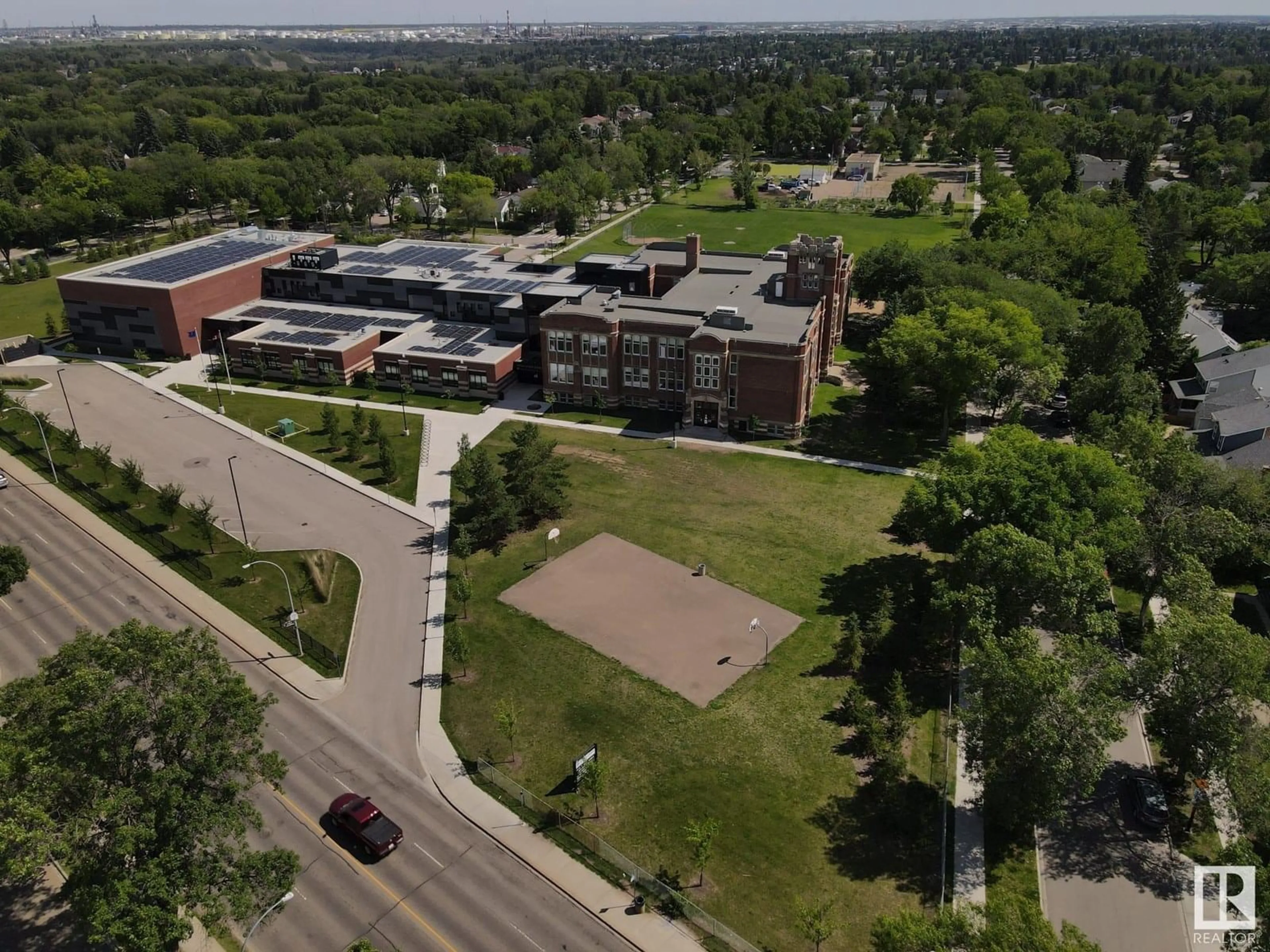A pic from outside/outdoor area/front of a property/back of a property/a pic from drone, unknown for #1 - 6120 118 AV, Edmonton Alberta T5W1E8