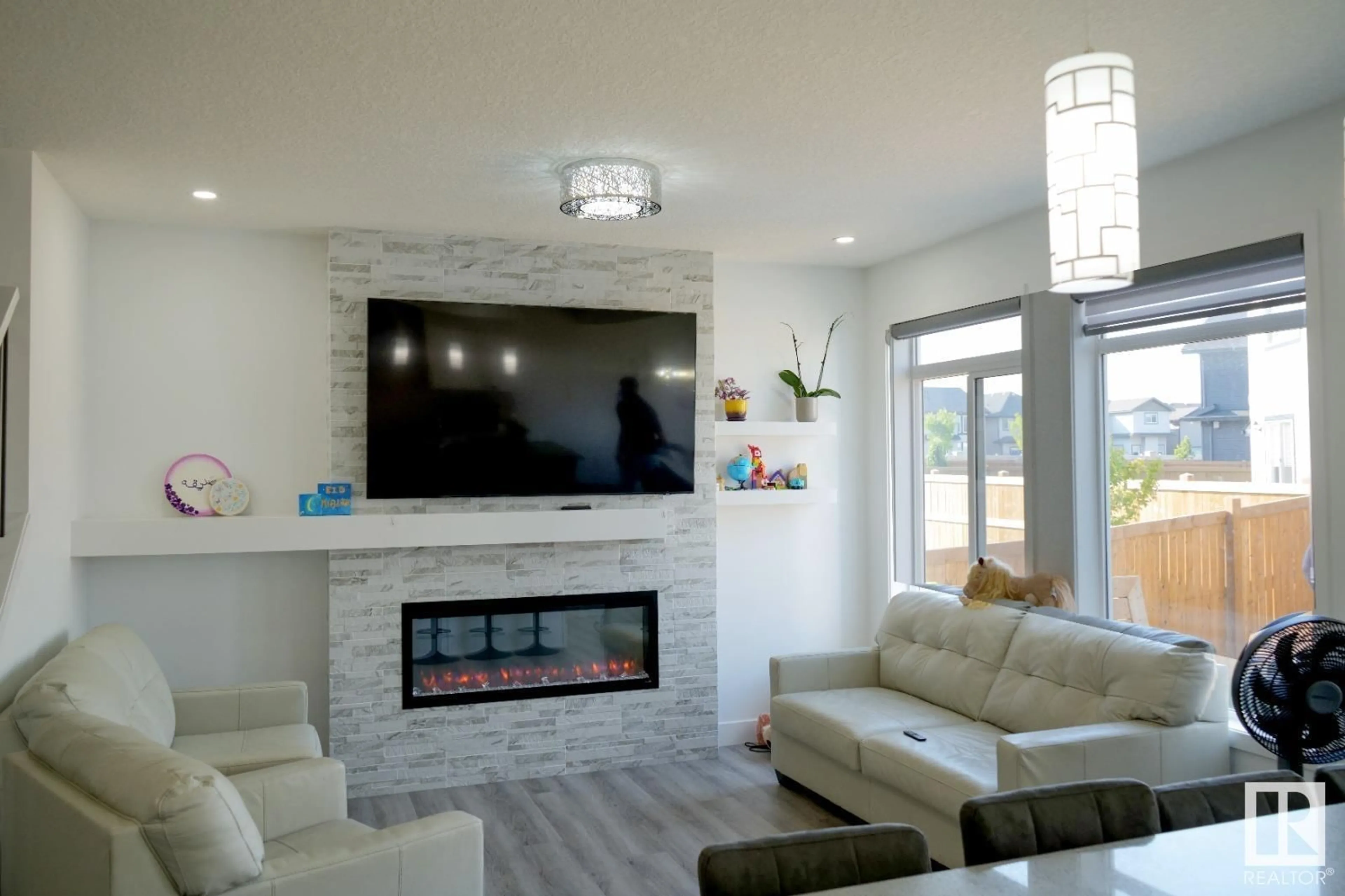 Living room with furniture, ceramic/tile floor for SW - 15940 19 AV, Edmonton Alberta T6W4X6