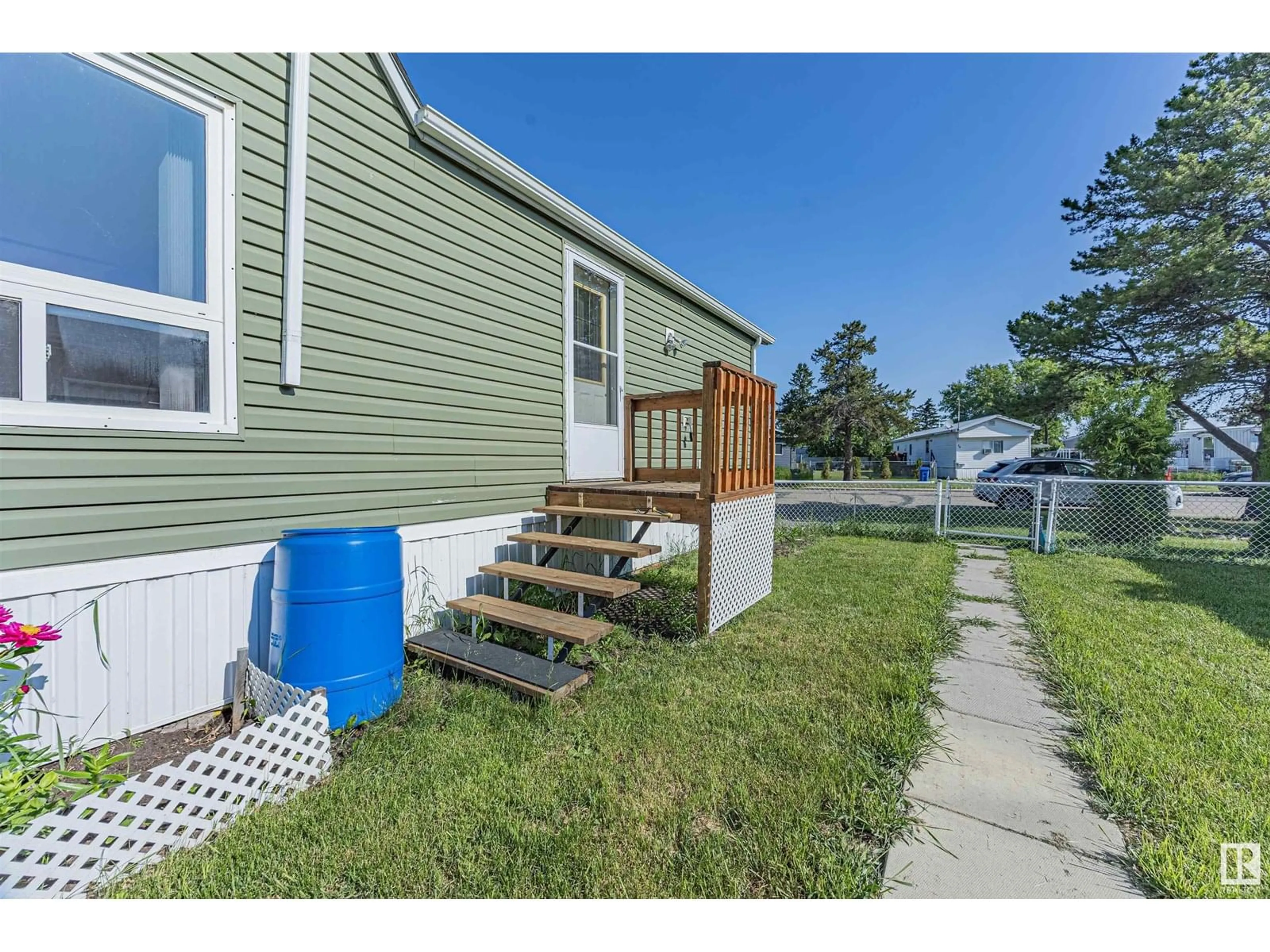 Home with vinyl exterior material, street for 67 4204 47 ST, Wetaskiwin Alberta T9A2H5
