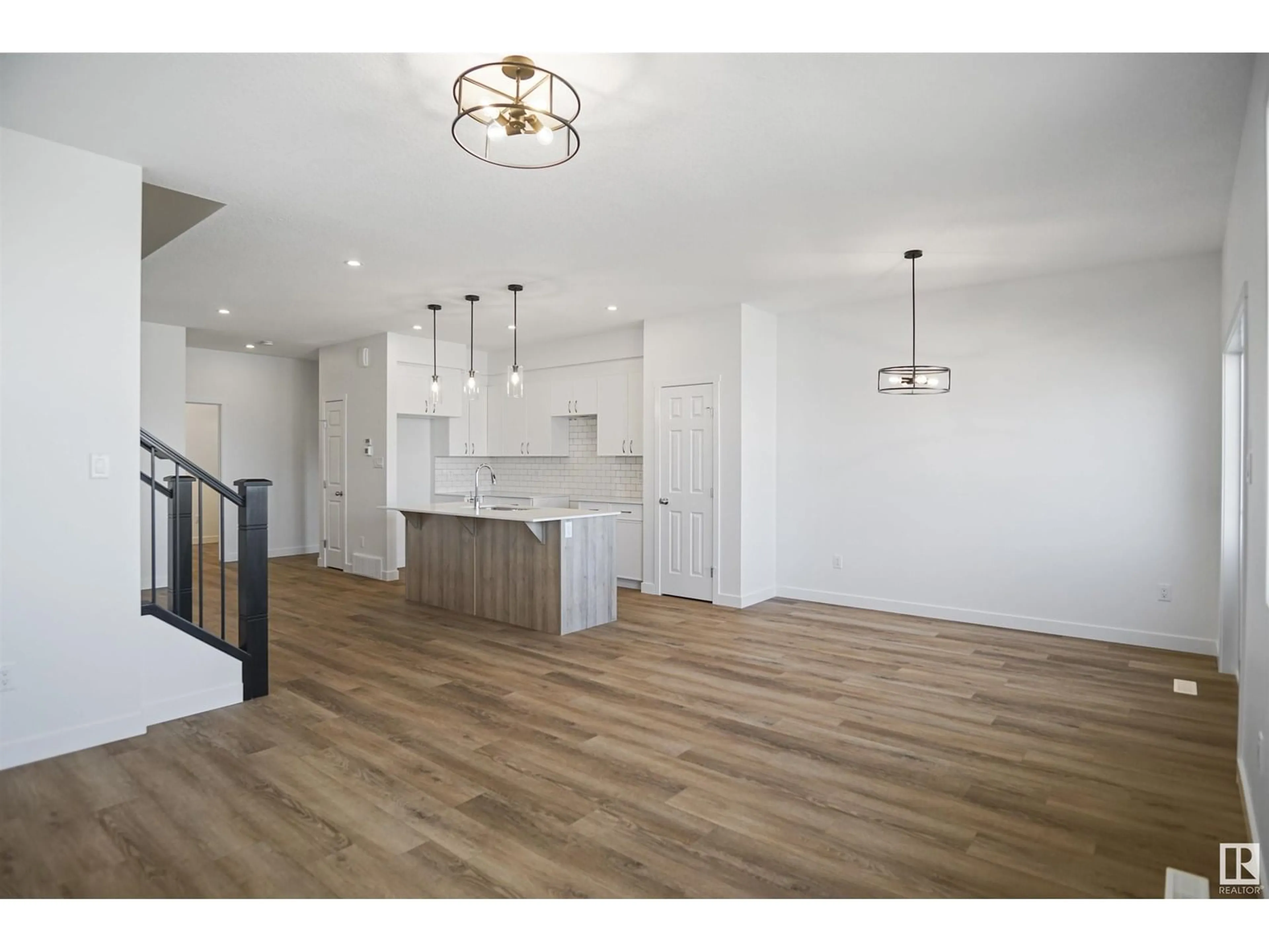 Open concept kitchen, wood/laminate floor for 17627 46 ST, Edmonton Alberta T5Y4B7
