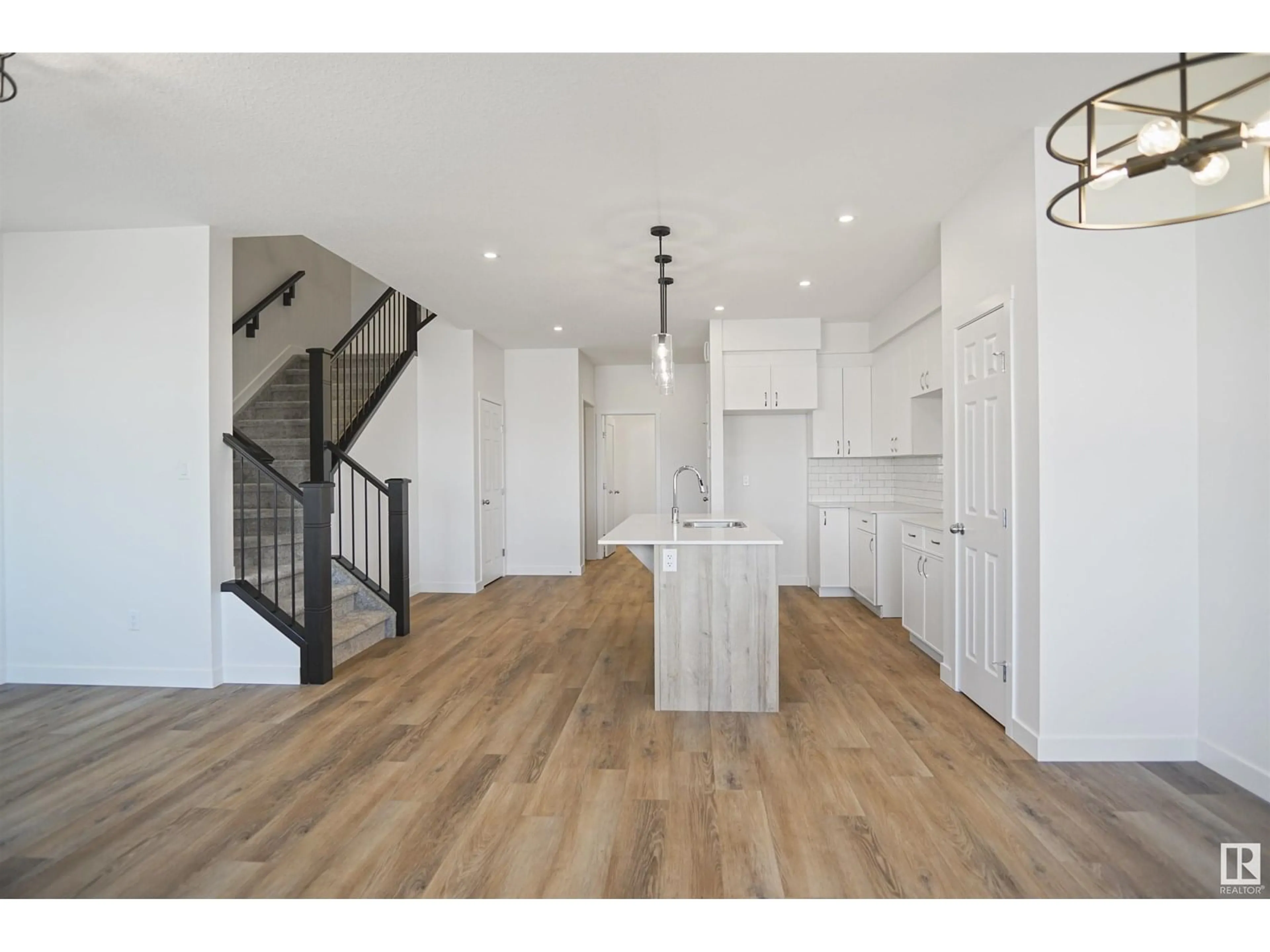Open concept kitchen, wood/laminate floor for 17627 46 ST, Edmonton Alberta T5Y4B7