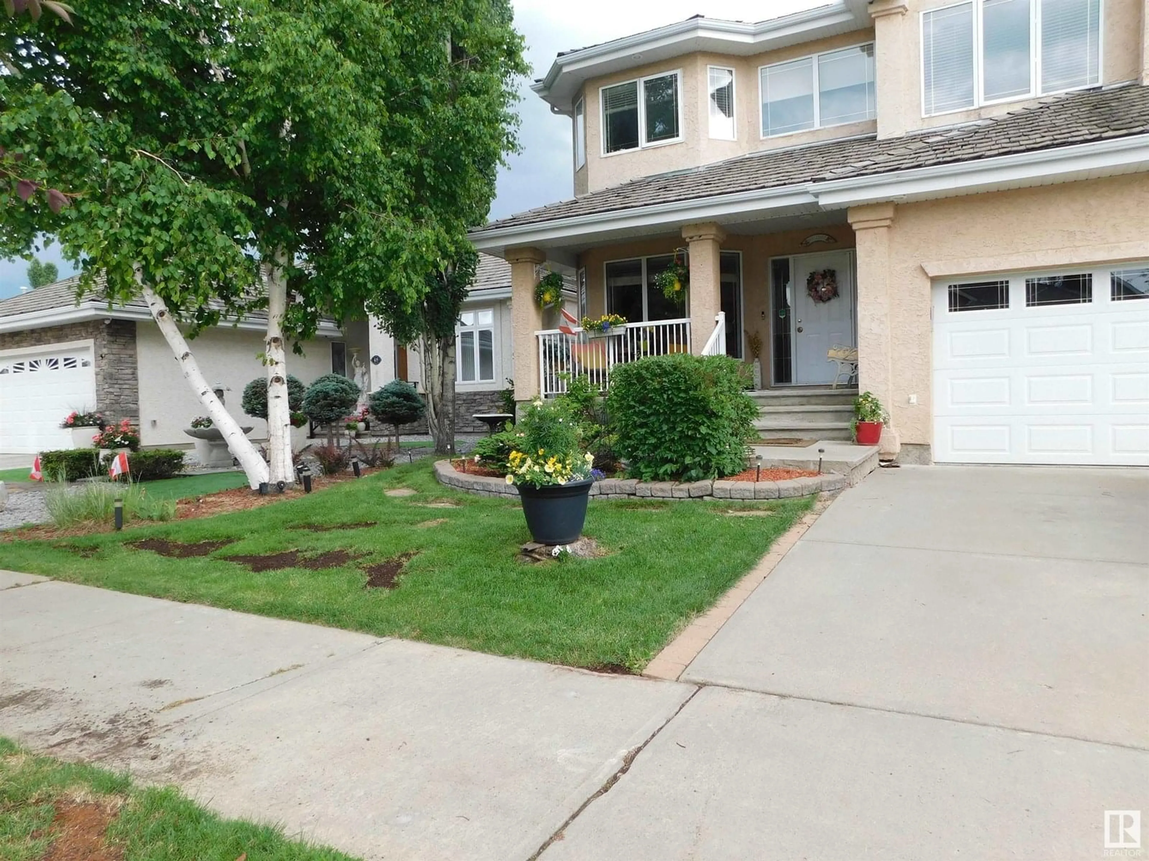 Home with vinyl exterior material, street for 617 DALHOUSIE CR, Edmonton Alberta T6M2T4