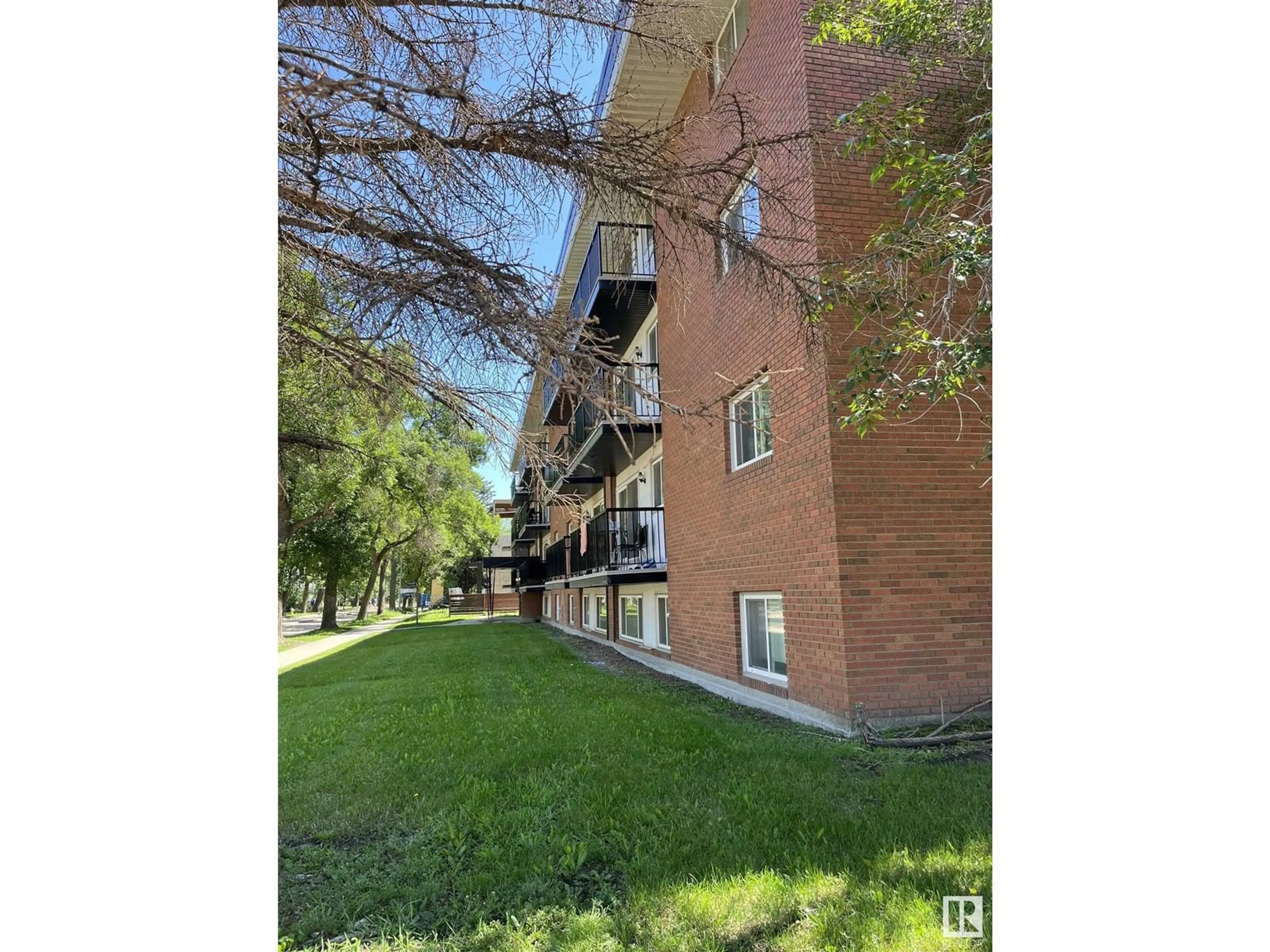 A pic from outside/outdoor area/front of a property/back of a property/a pic from drone, street for 201 - 10149 83 AV NW, Edmonton Alberta T6E2C5