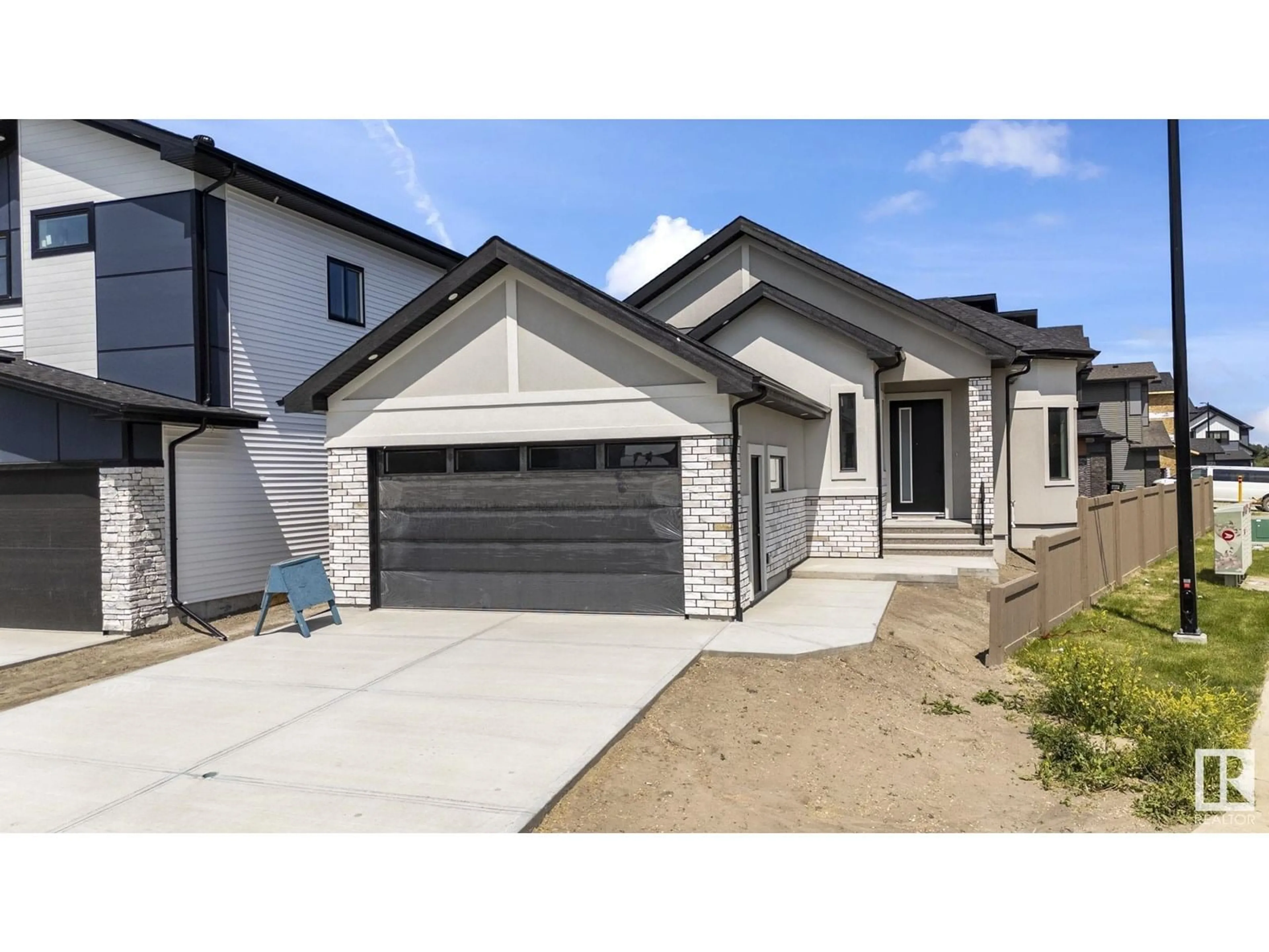 Home with vinyl exterior material, street for NE - 296 165 AV, Edmonton Alberta T5Y4J3
