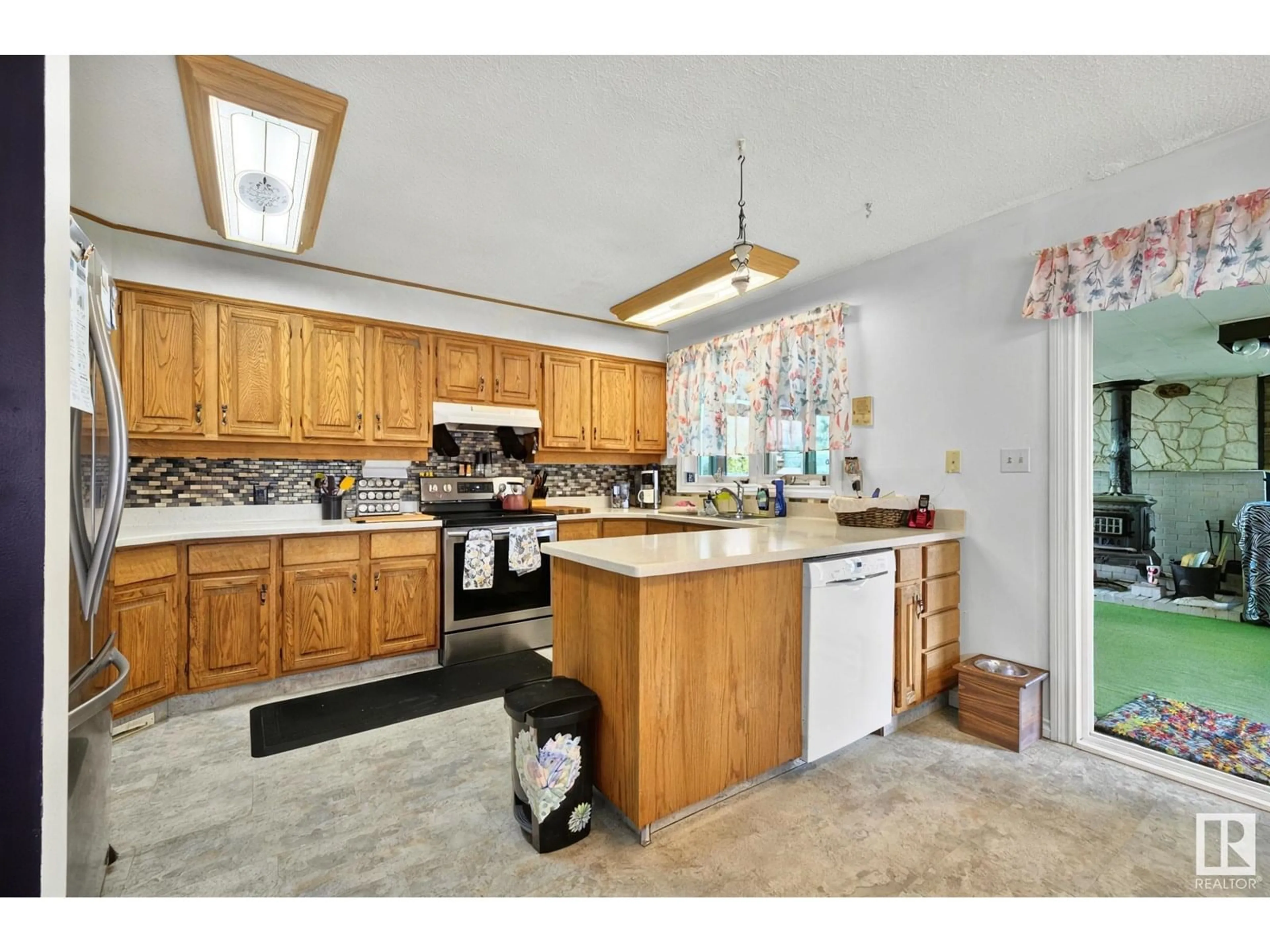Open concept kitchen, ceramic/tile floor for 10420 32 AV, Edmonton Alberta T6J4E8