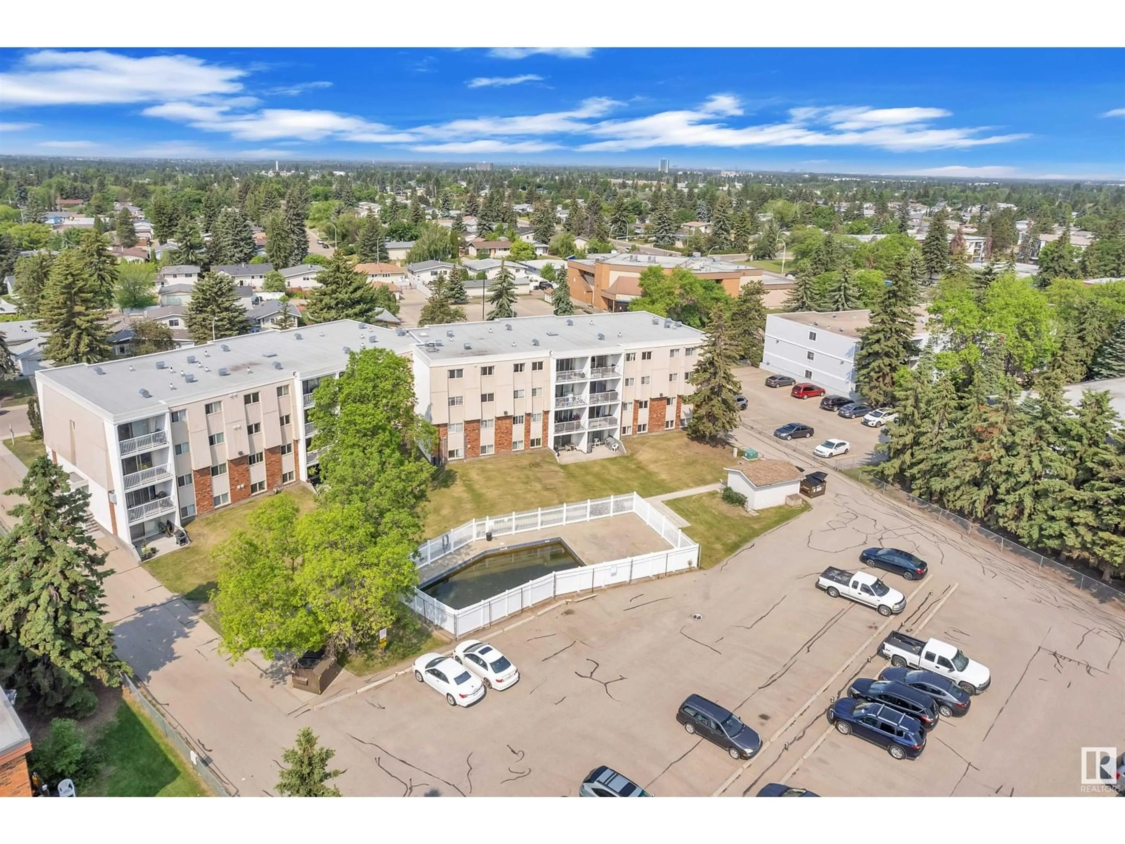 A pic from outside/outdoor area/front of a property/back of a property/a pic from drone, mountain view for #301 - 3835 107 ST NW, Edmonton Alberta T6J2N7