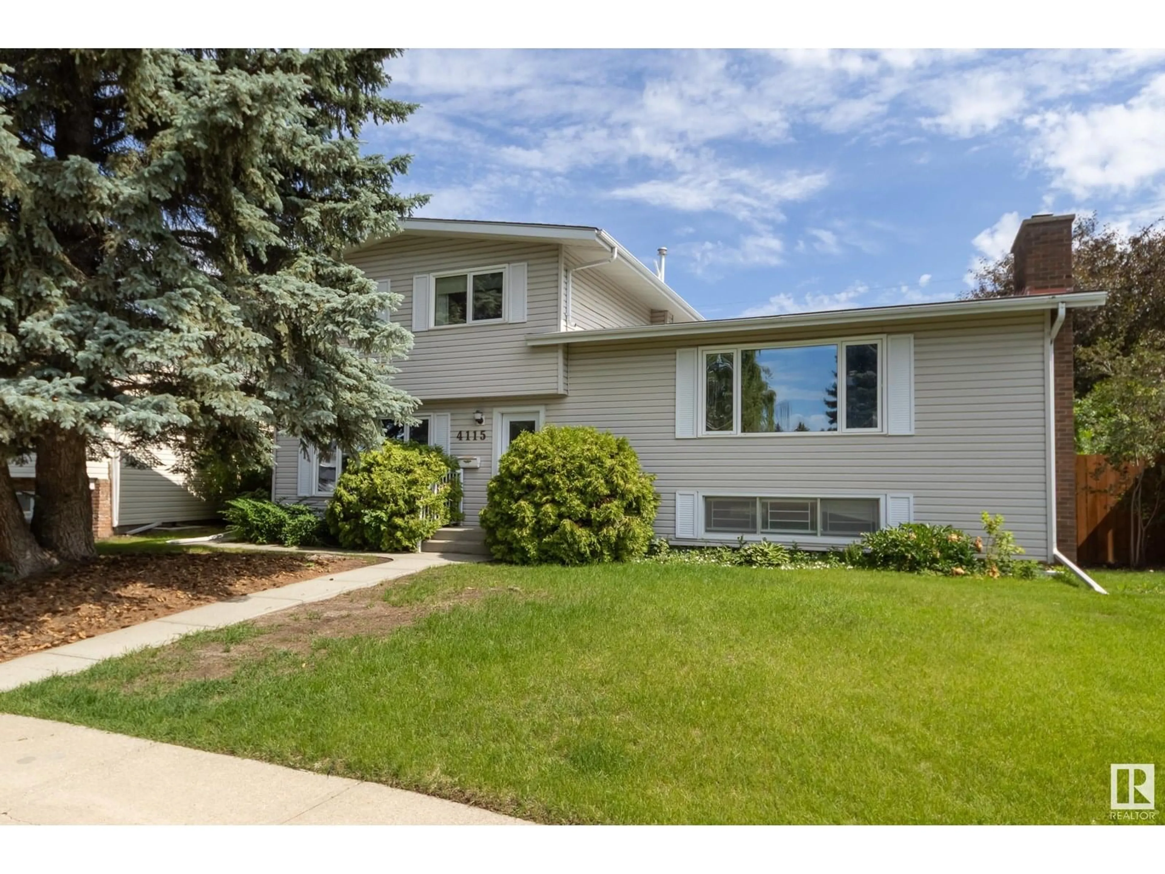 Home with vinyl exterior material, street for NW - 4115 123 ST, Edmonton Alberta T6J1Z6