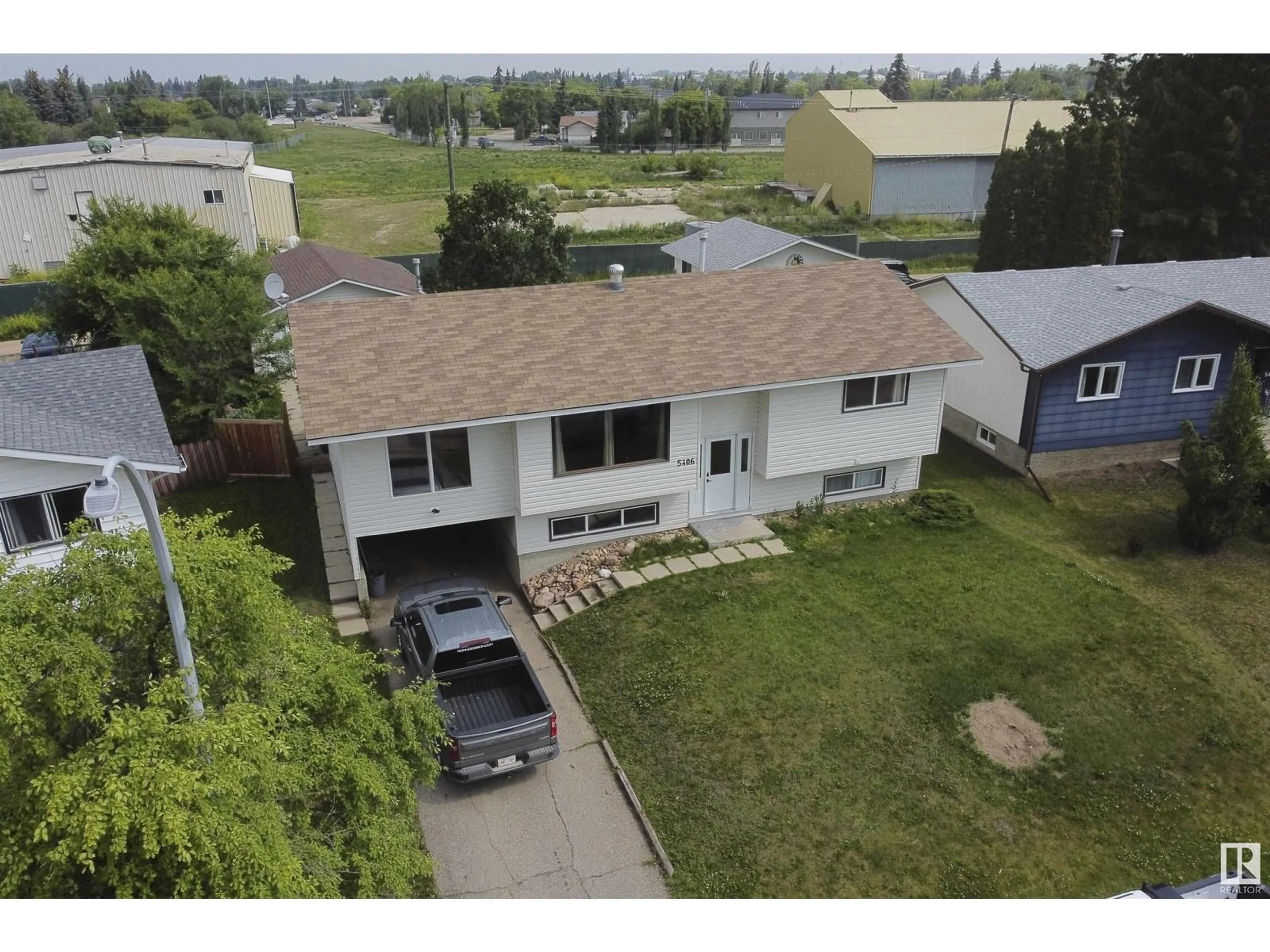 A pic from outside/outdoor area/front of a property/back of a property/a pic from drone, mountain view for 5406 49 AV, Barrhead Alberta T7N1G2