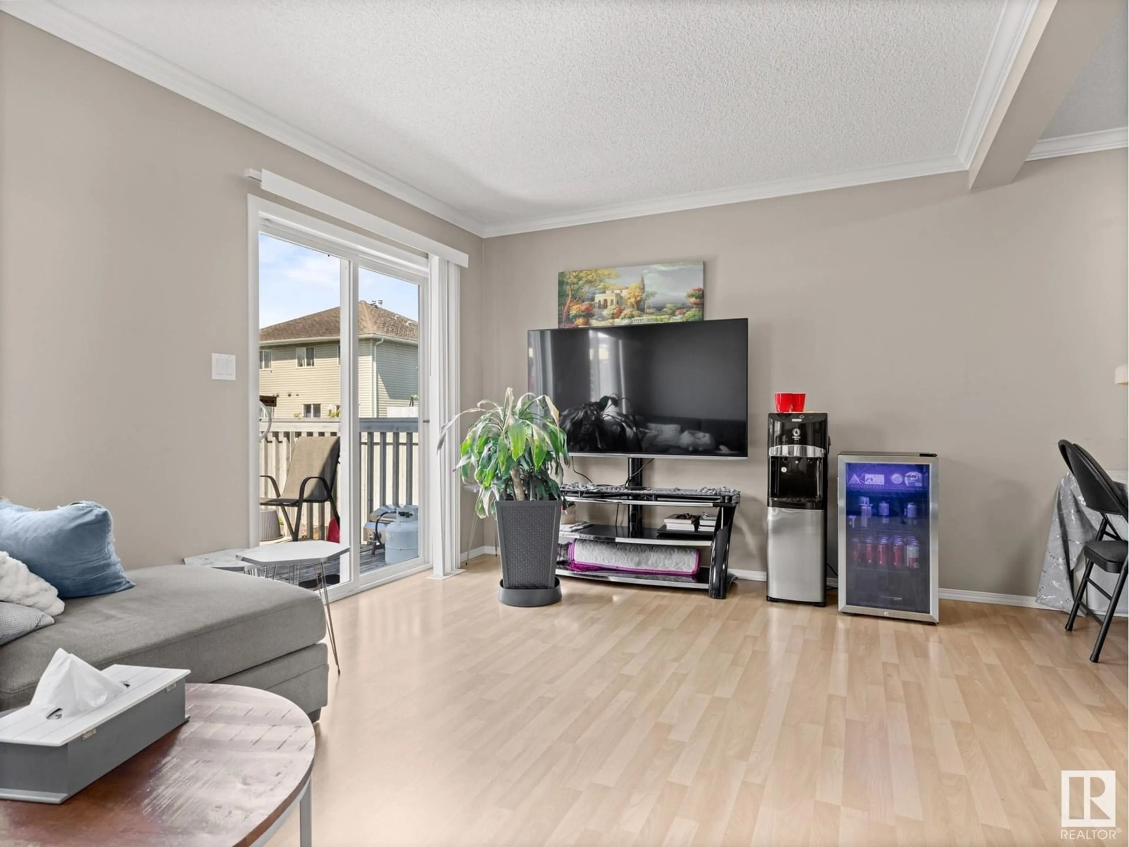 Living room with furniture, wood/laminate floor for NW - 3718 138A AV, Edmonton Alberta T5Y3G5