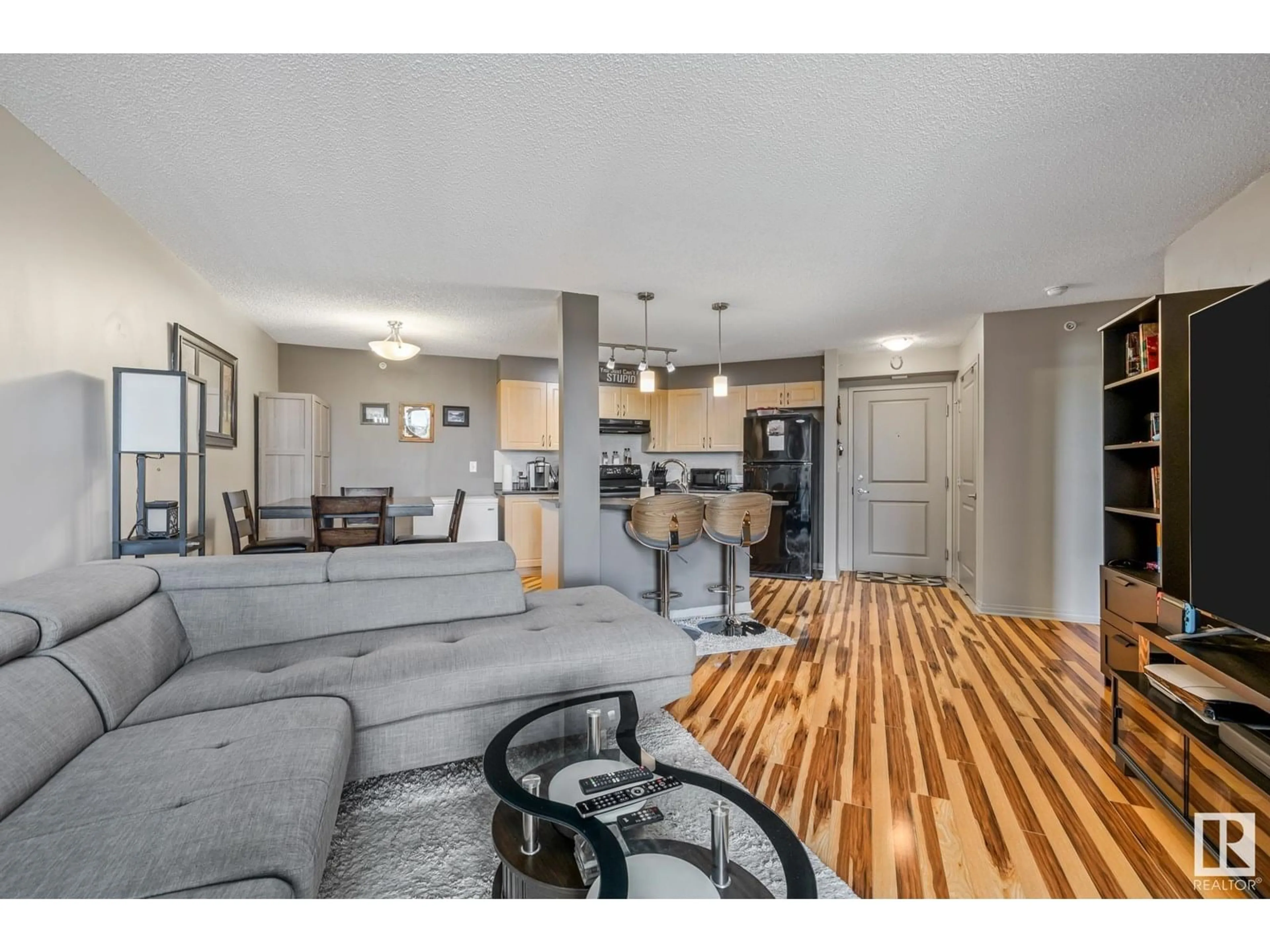 Open concept kitchen, wood/laminate floor for #412 - 11449 ELLERSLIE RD SW, Edmonton Alberta T6W1T2